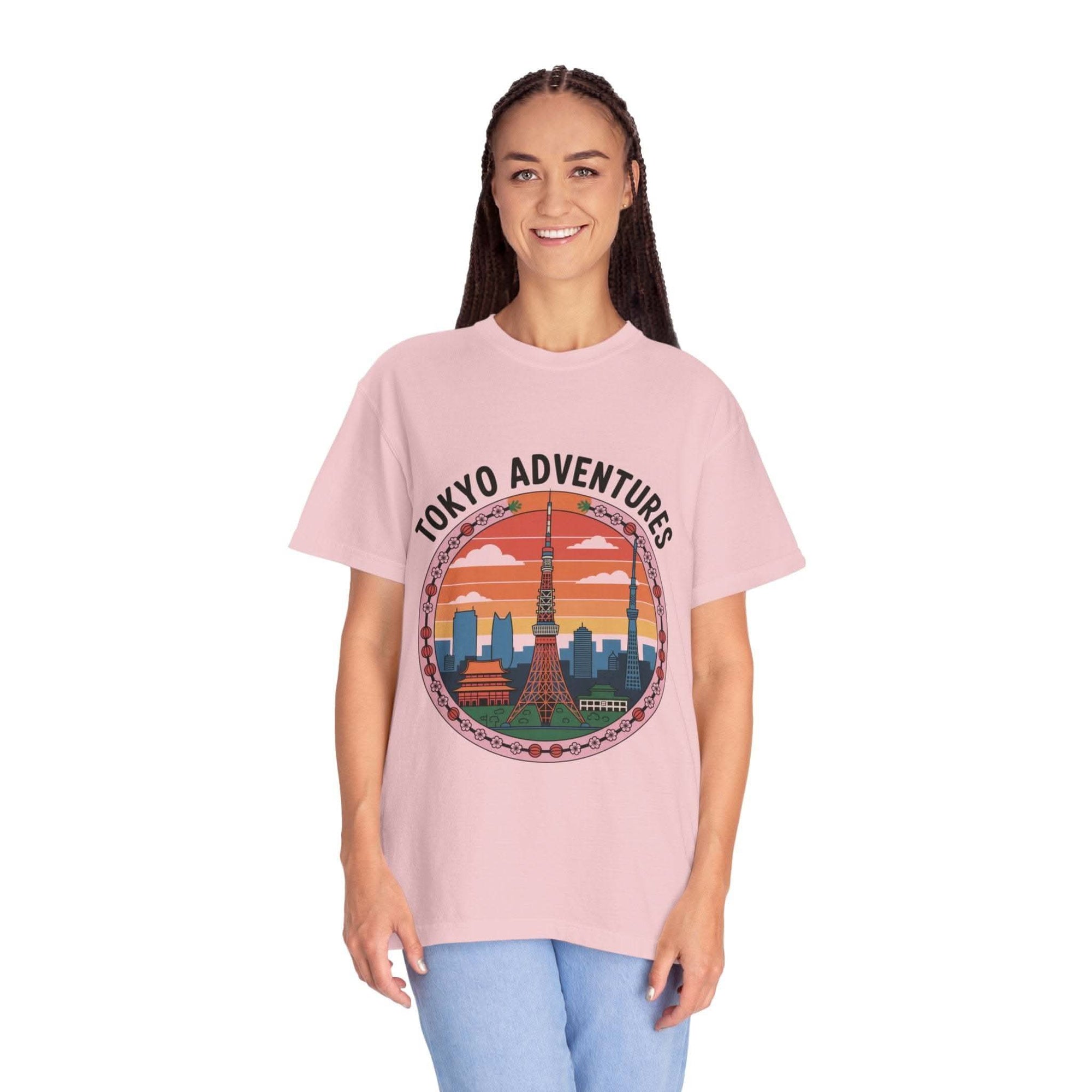 Woman wearing pink garment-dyed T-shirt with Tokyo Adventures travel graphic design