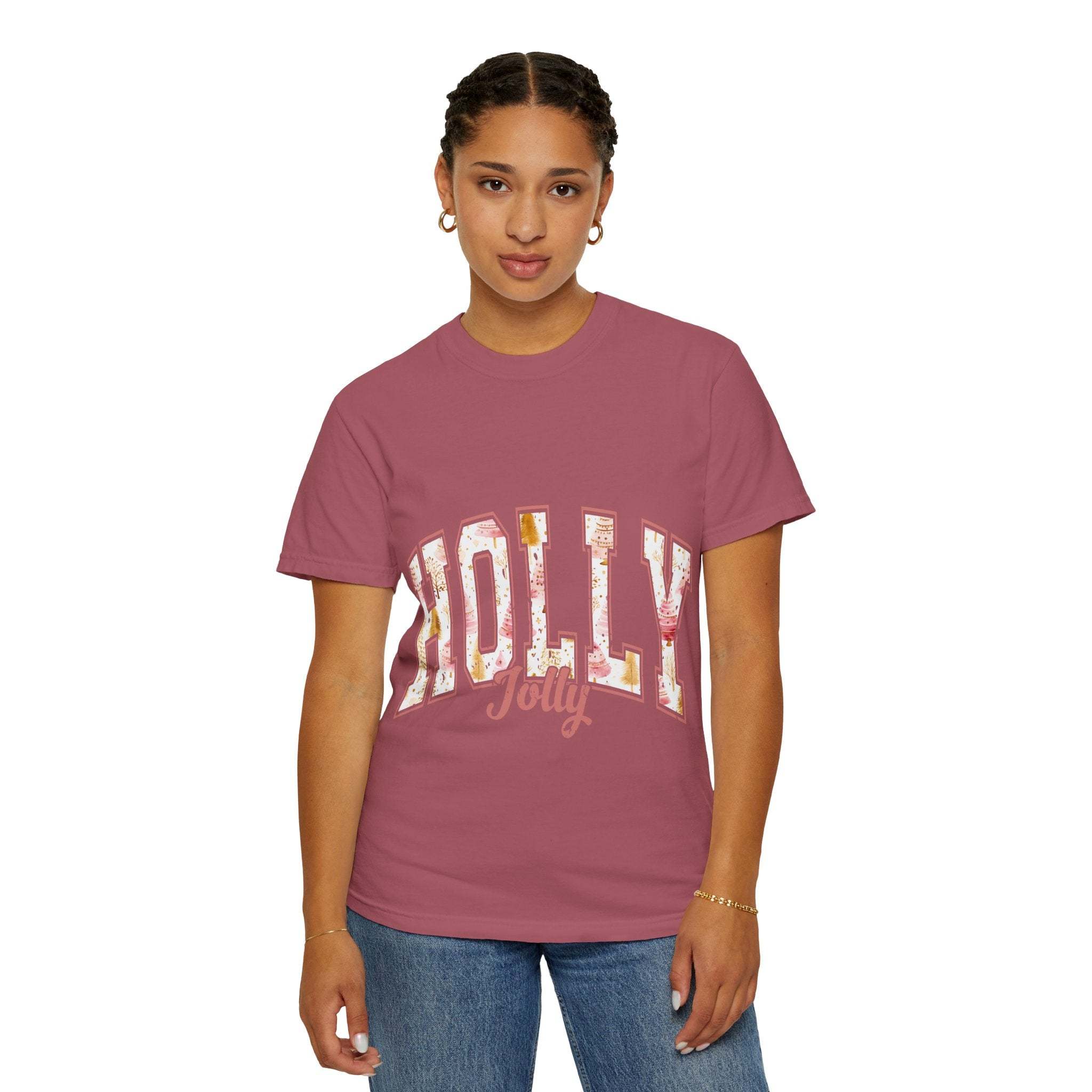 woman wearing maroon Varsity Holly Jolly T-shirt with festive print and jeans