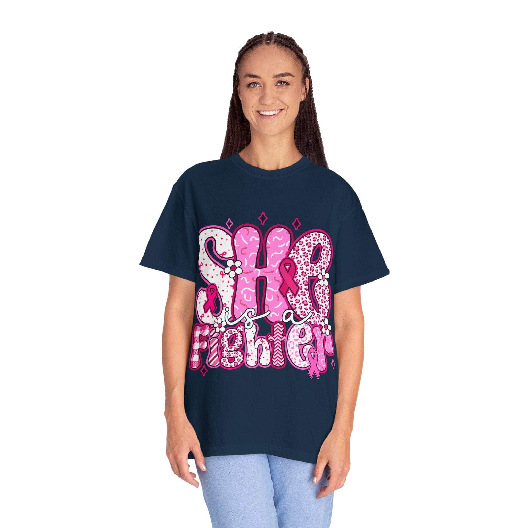 Woman wearing navy unisex Fighter Breast Cancer T-shirt with pink graphic design