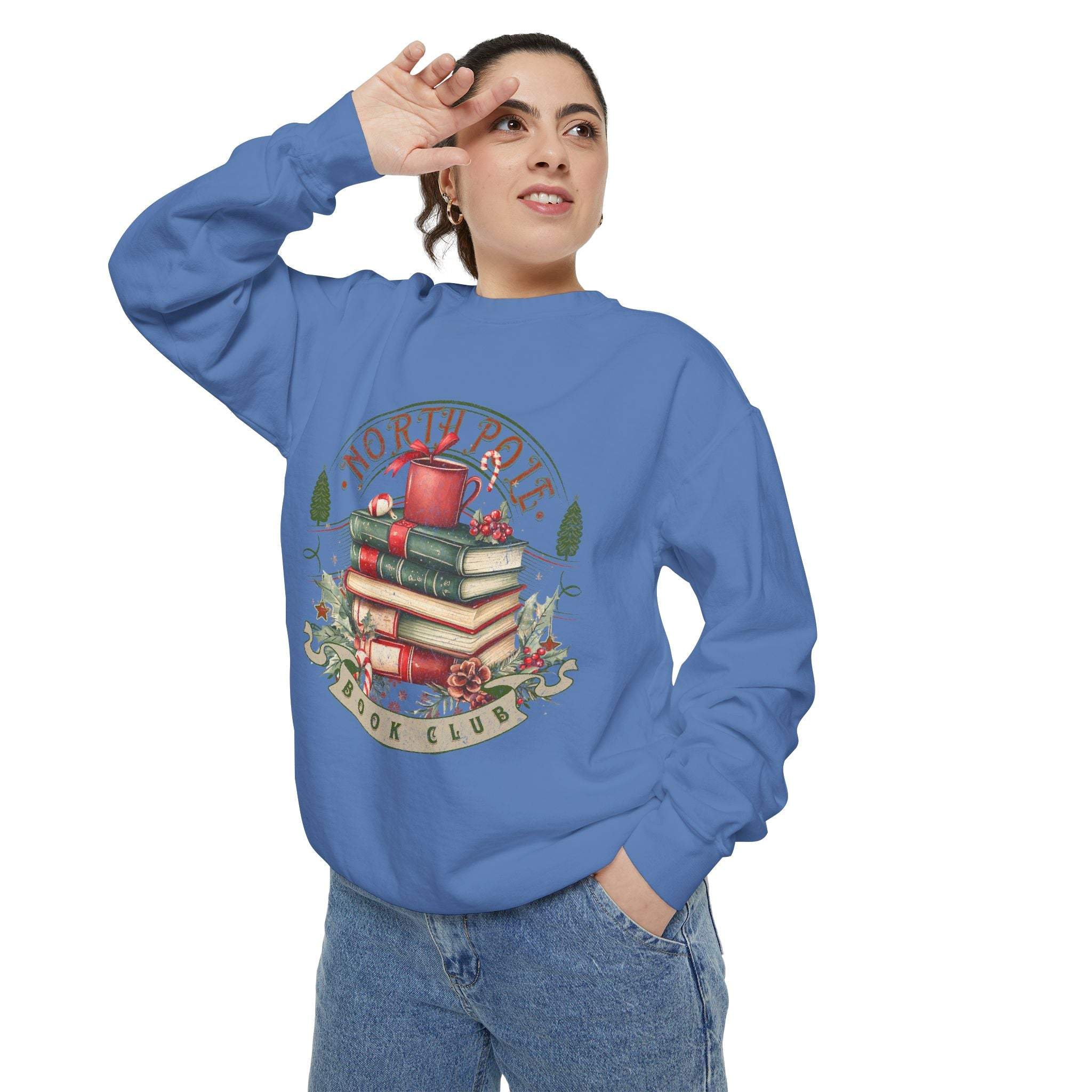 woman wearing blue Vintage North Pole Book Club sweatshirt with book stack design