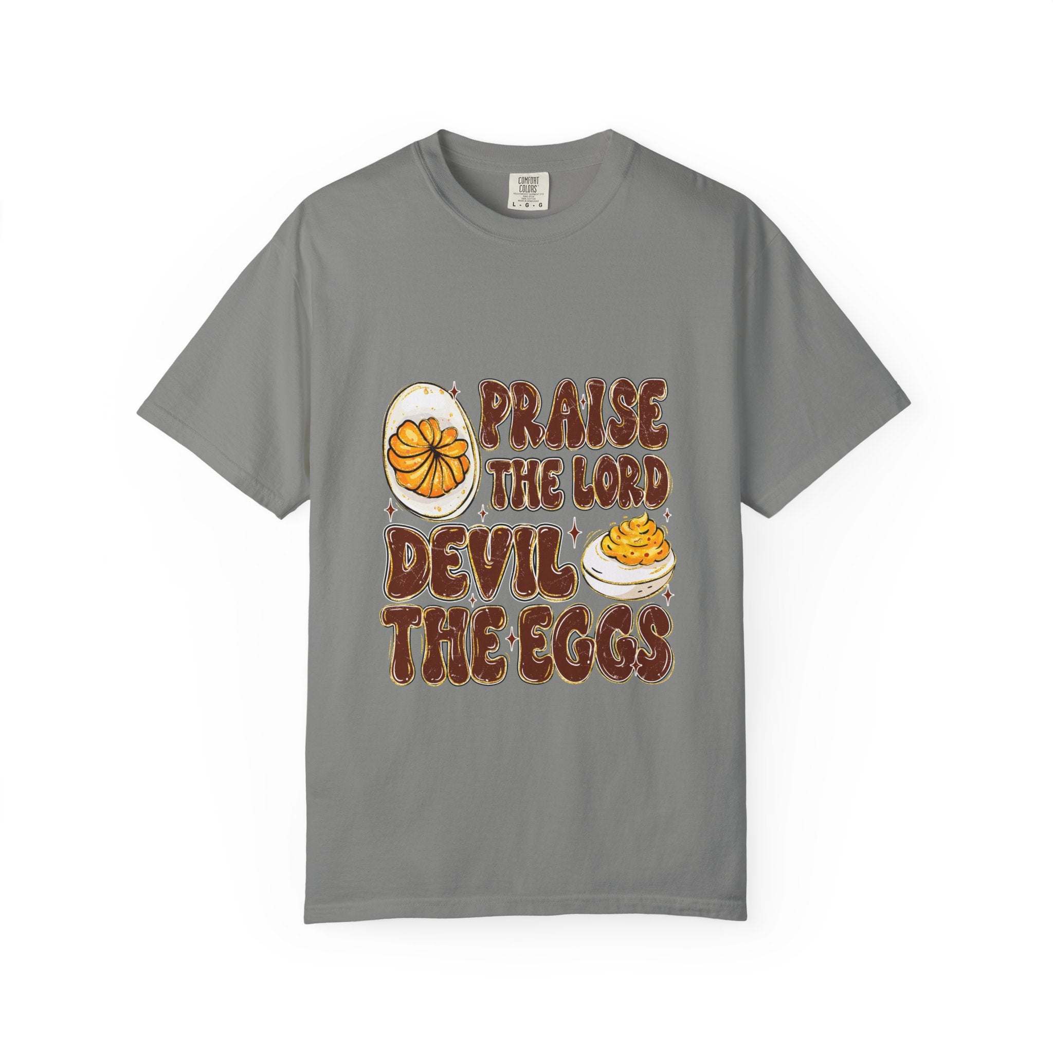 White cotton t-shirt featuring 'Praise the Lord, Devil the Eggs' design, perfect for Easter and Christian apparel.