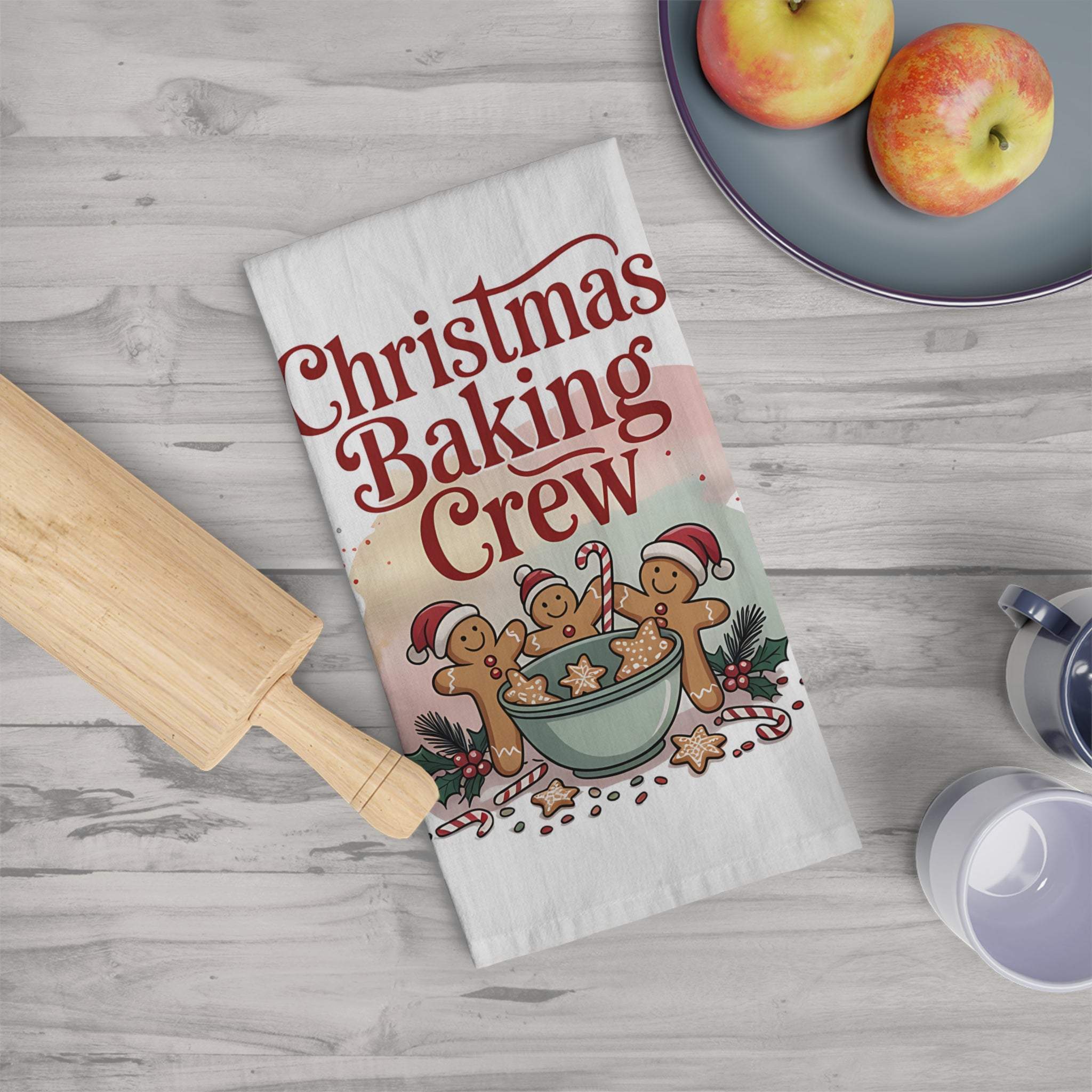 Cotton Christmas Baking Crew tea towel with festive gingerbread design on kitchen counter