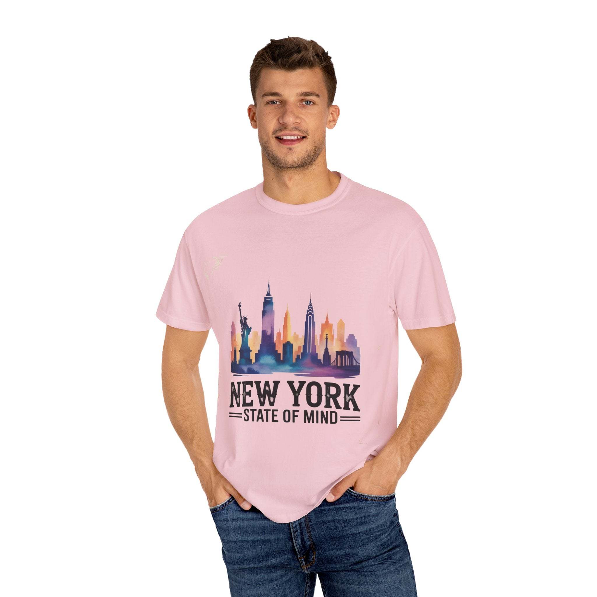 Man wearing pink garment-dyed T-shirt with New York State of Mind city skyline design