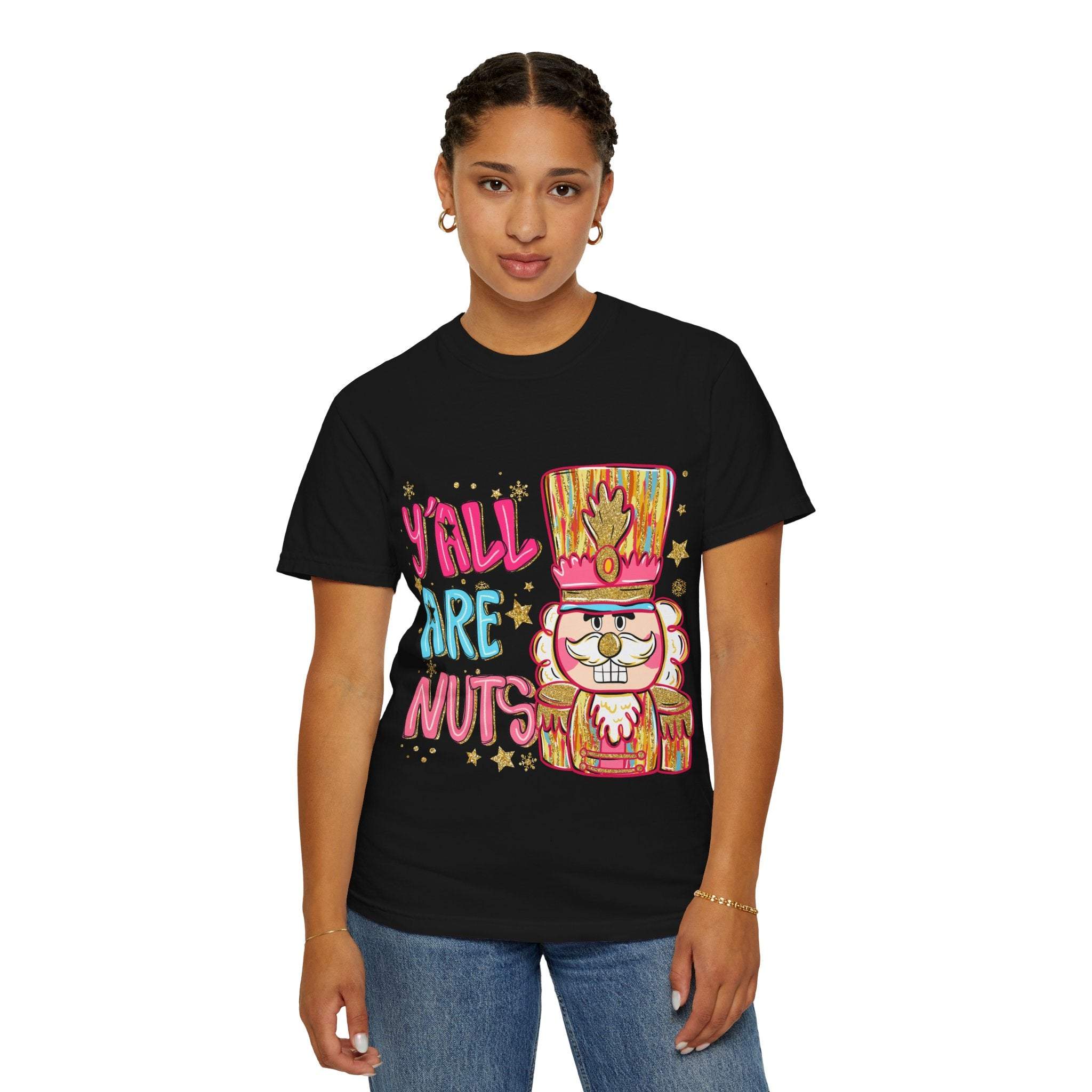 Woman wearing black Yall Are Nuts Nutcracker festive cotton T-shirt with colorful nutcracker design