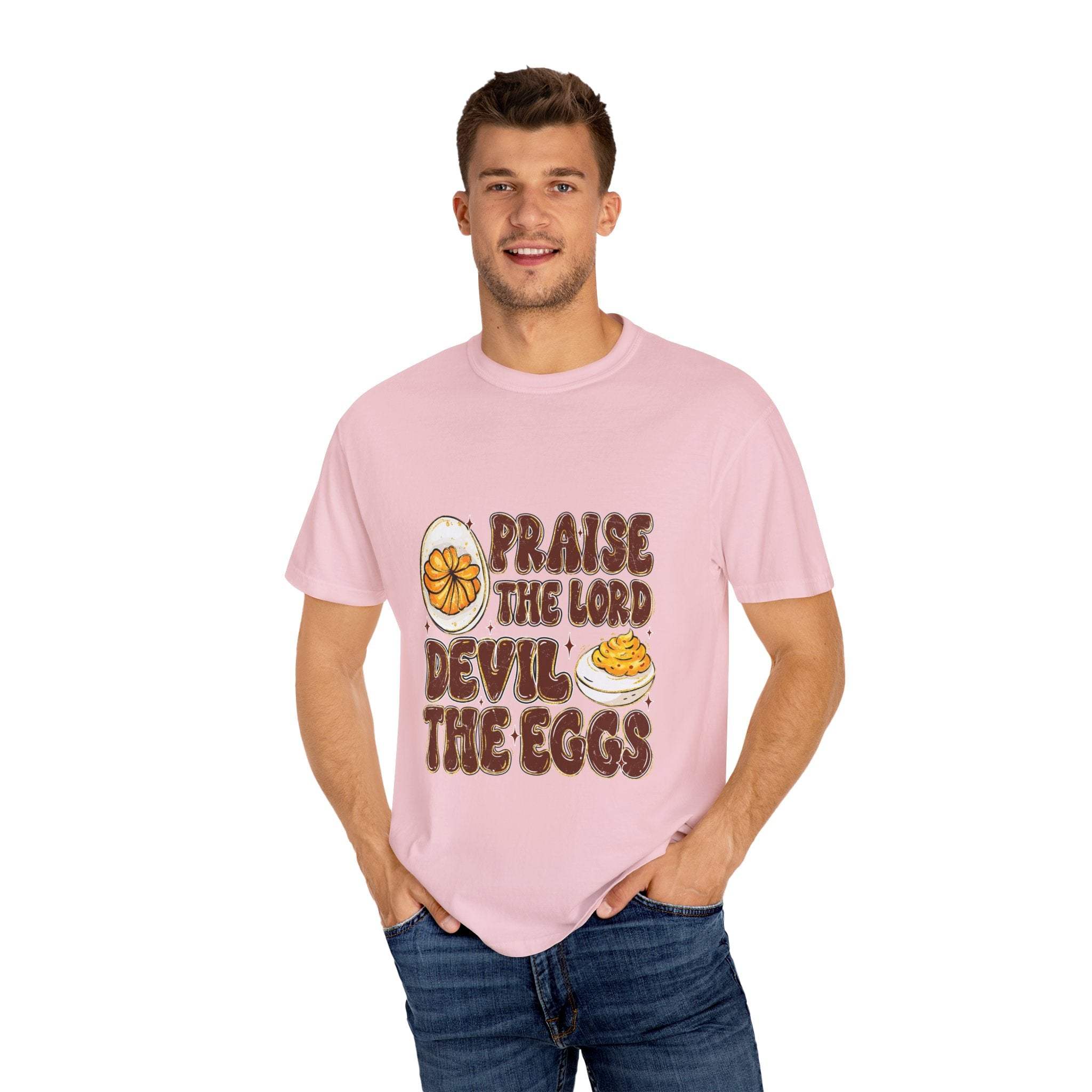 White cotton t-shirt featuring 'Praise the Lord, Devil the Eggs' design, perfect for Easter and Christian apparel.