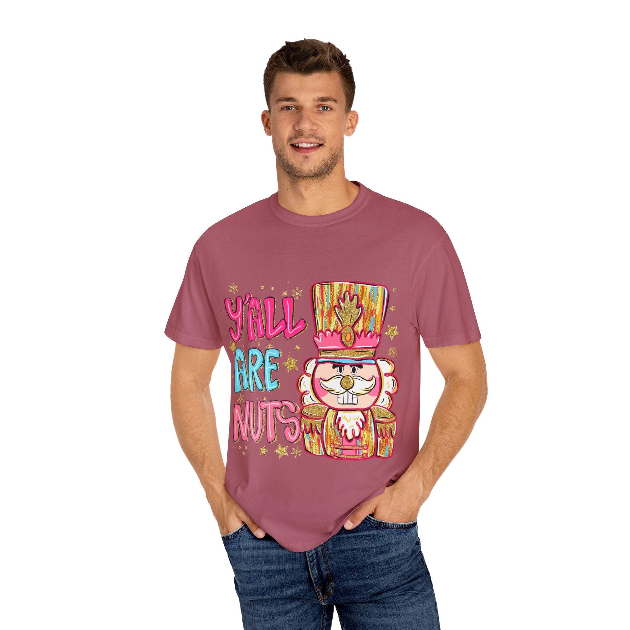 Man wearing Yall Are Nuts Nutcracker preppy T-shirt in faded mauve color