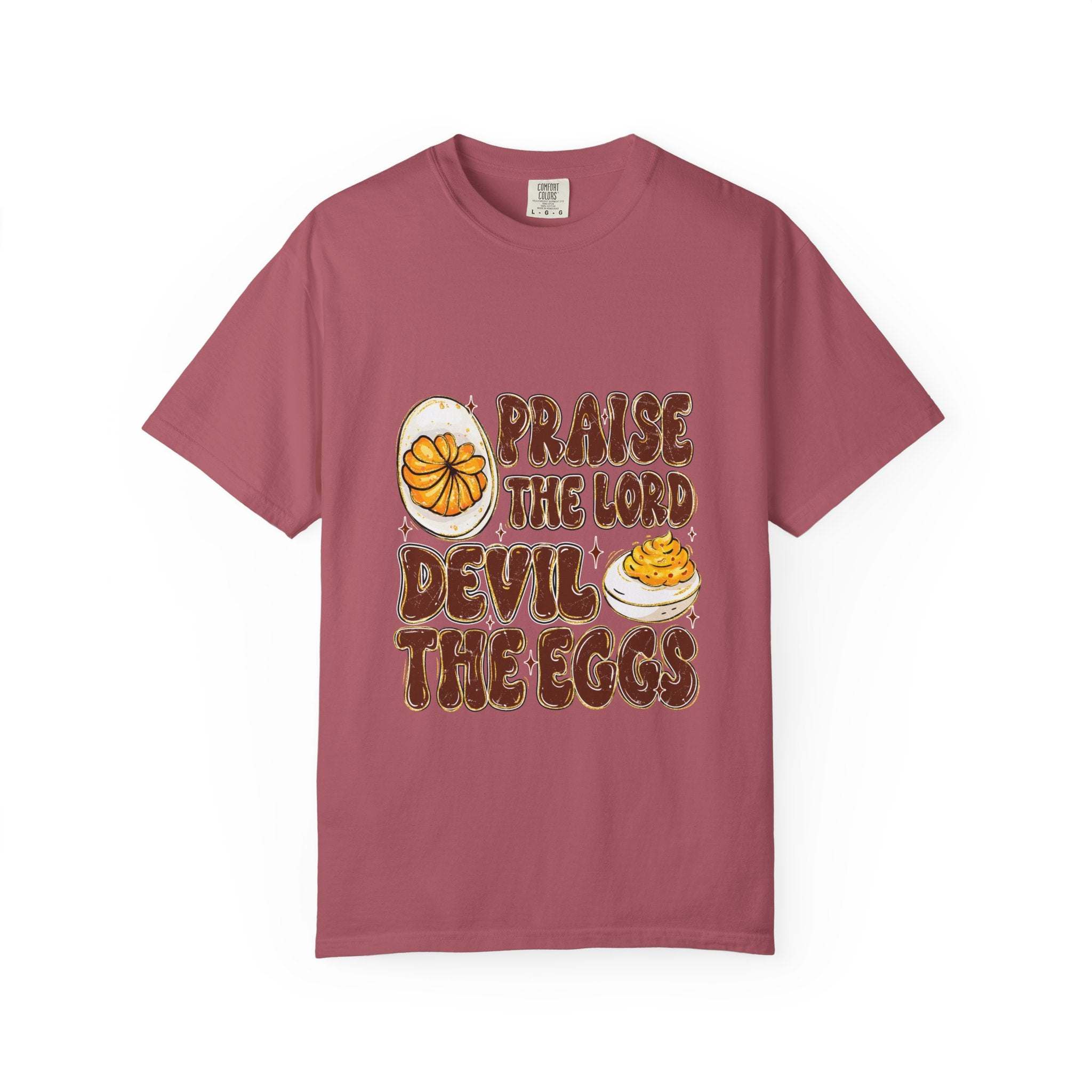 White cotton t-shirt featuring 'Praise the Lord, Devil the Eggs' design, perfect for Easter and Christian apparel.