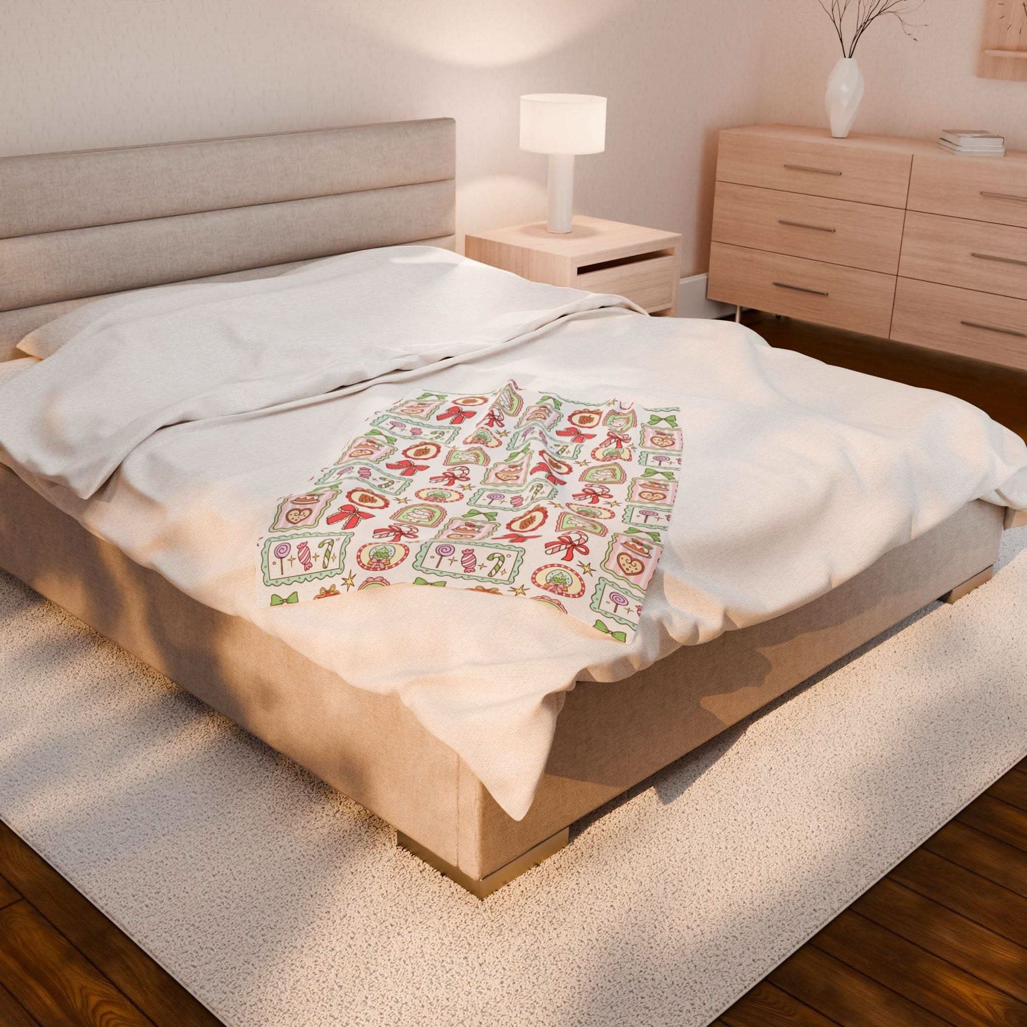 Velveteen plush blanket with retro Christmas frames on a bed in cozy bedroom setting