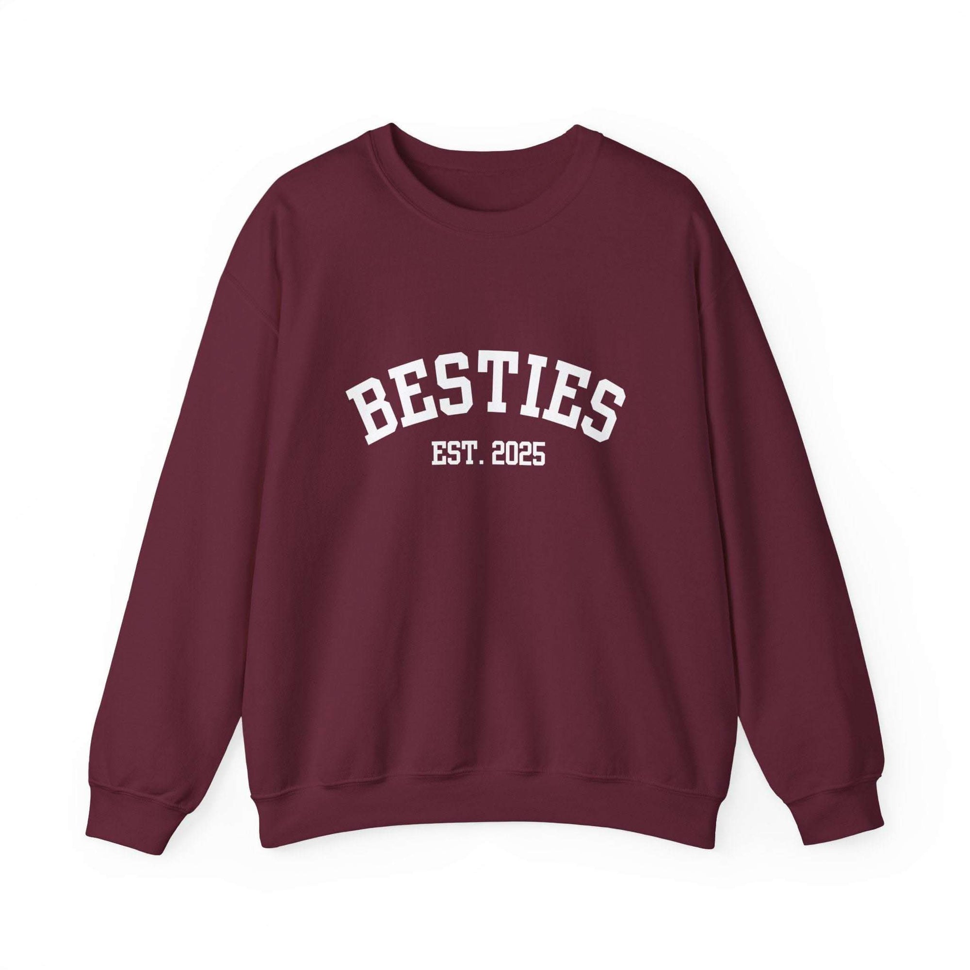 Maroon sweatshirt with 'BESTIES EST. 2025' text on a white background