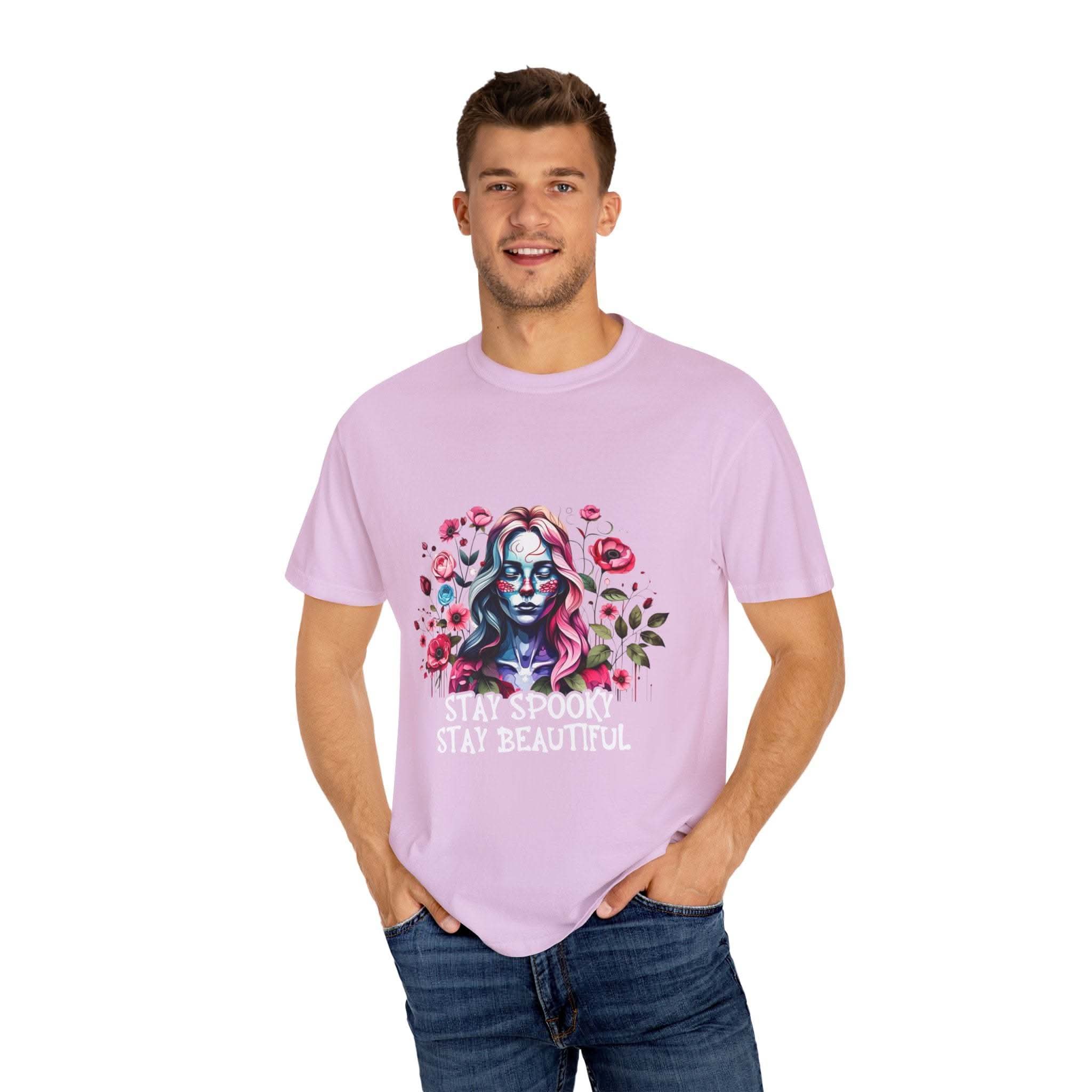 Man wearing soft everyday tee with elegant floral skeleton print and text stay spooky stay beautiful