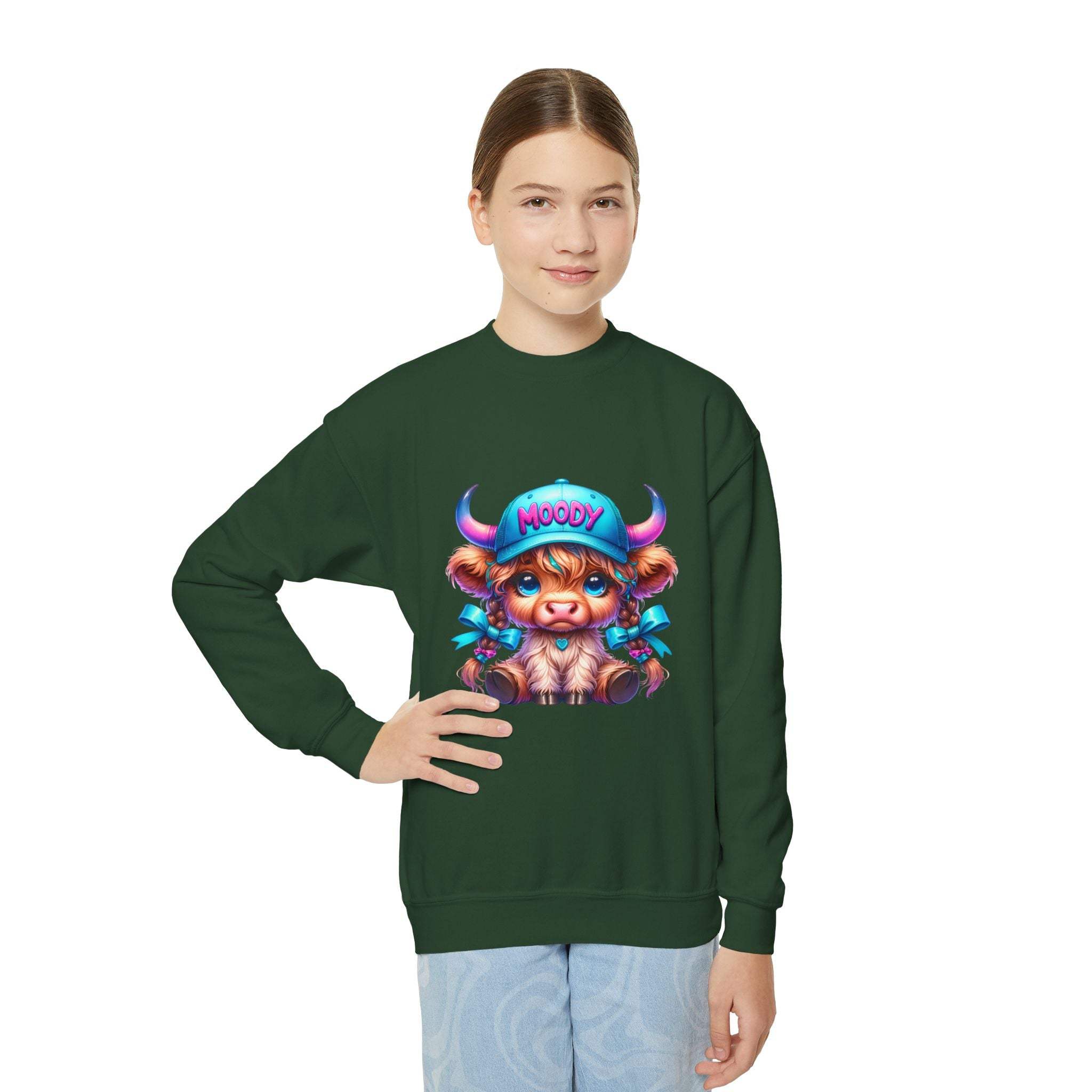 Youth wearing Moody Girl Highland Cow green sweatshirt with colorful cartoon cow illustration
