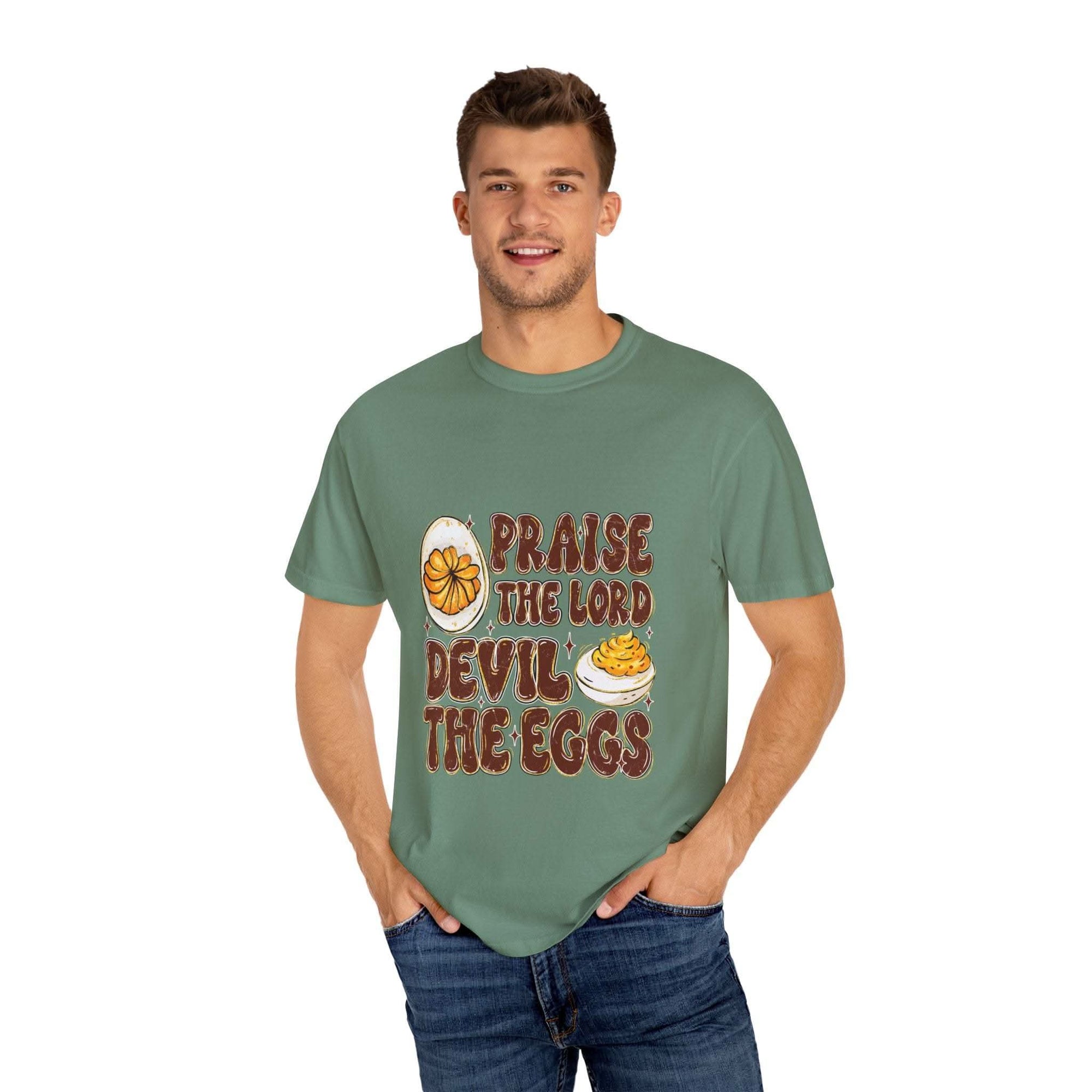 White cotton t-shirt featuring 'Praise the Lord, Devil the Eggs' design, perfect for Easter and Christian apparel.