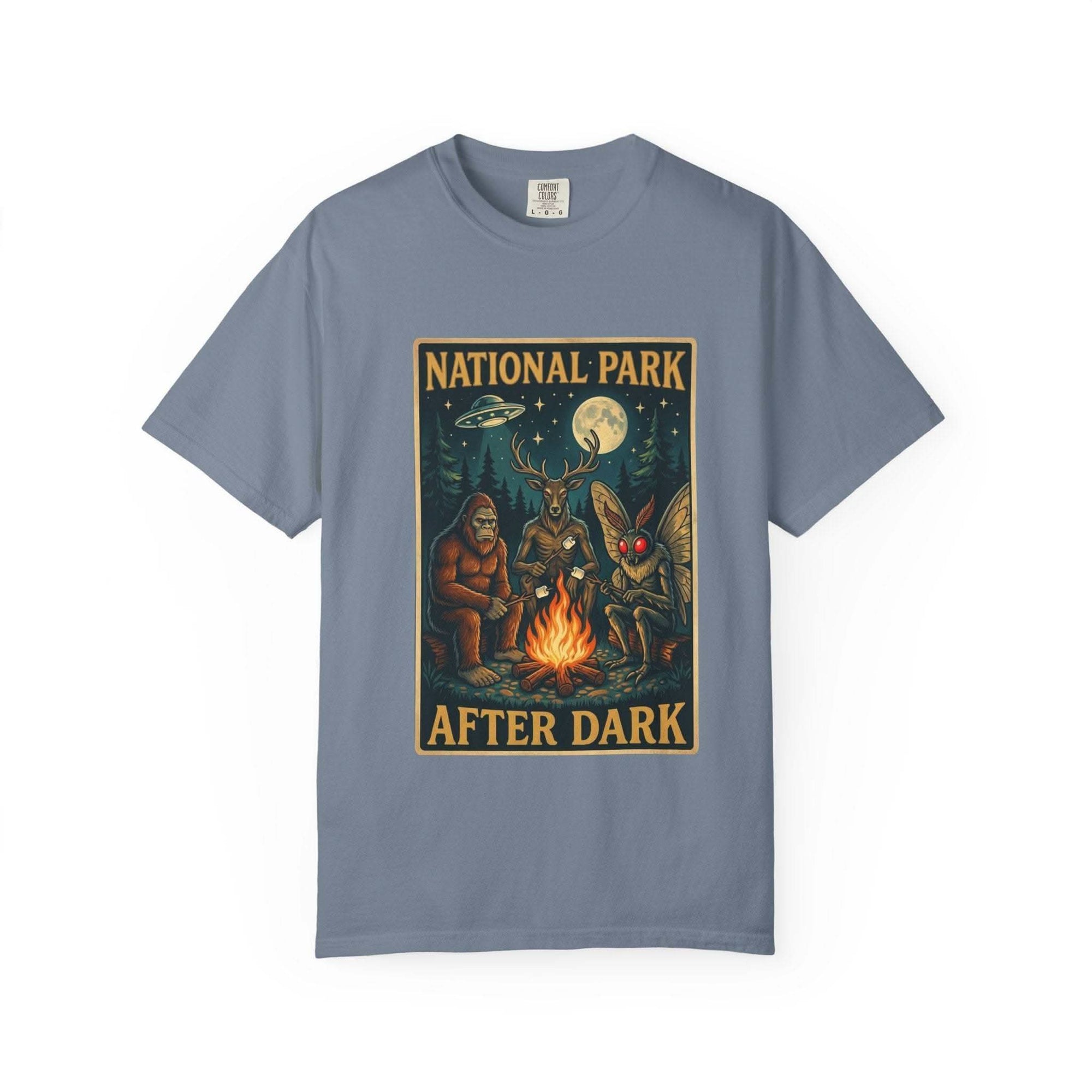 National Park After Dark T-shirt featuring campfire, Sasquatch, Mothman, and night creatures in vintage woodland scene