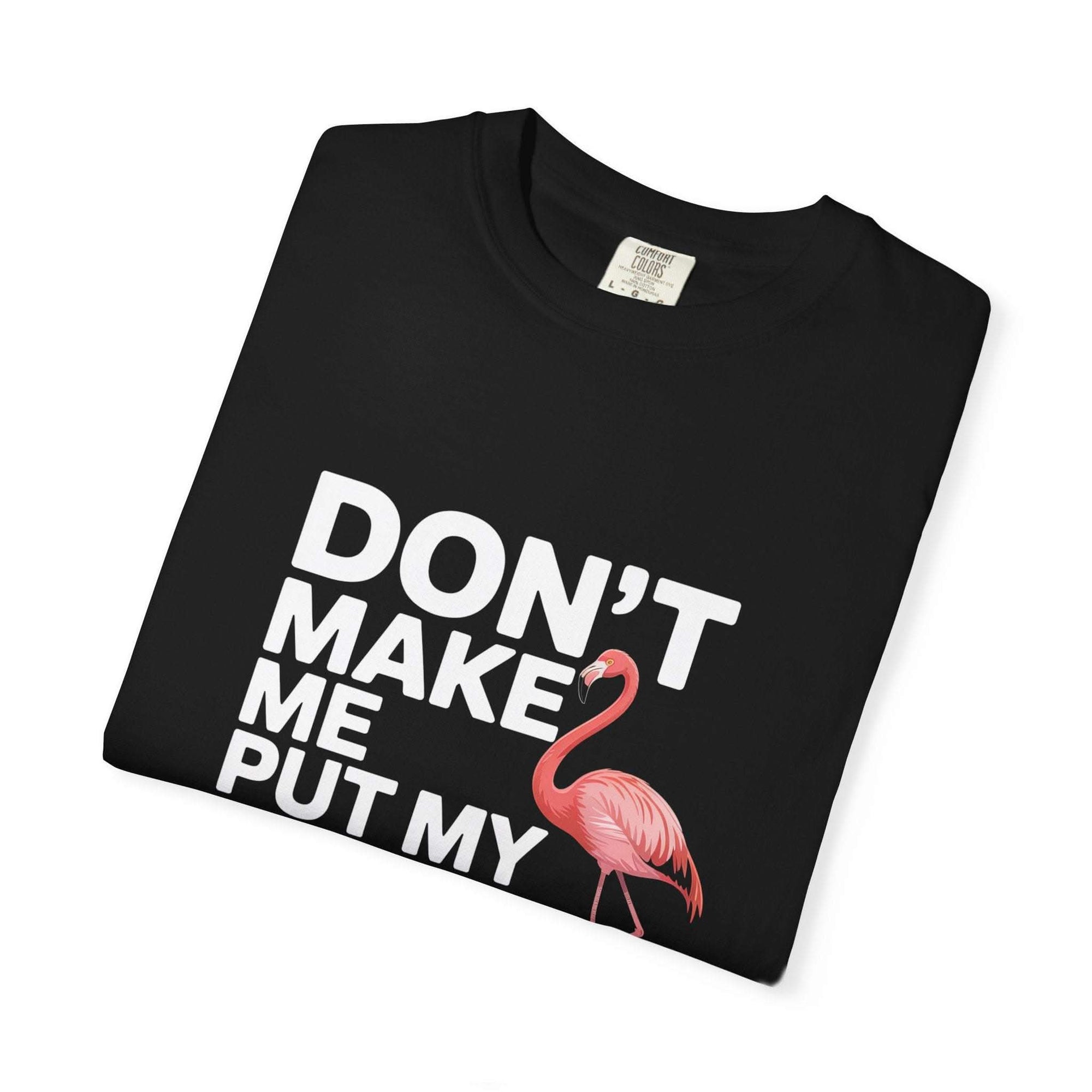 Dont Make Me Put My Foot Down flamingo t-shirt with humorous pink bird graphic and bold white text on vintage dyed fabric