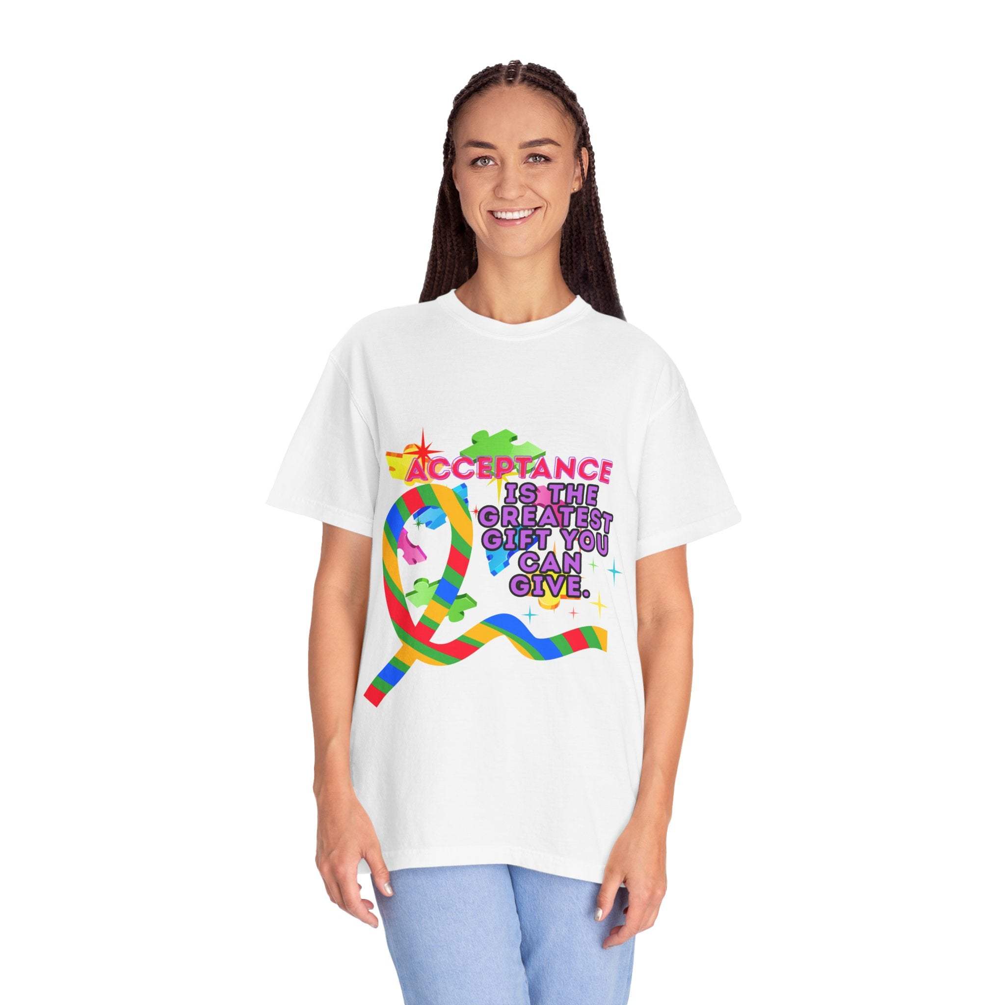 Woman wearing white garment-dyed T-shirt with colorful Autism Acceptance design and text promoting inclusivity and support