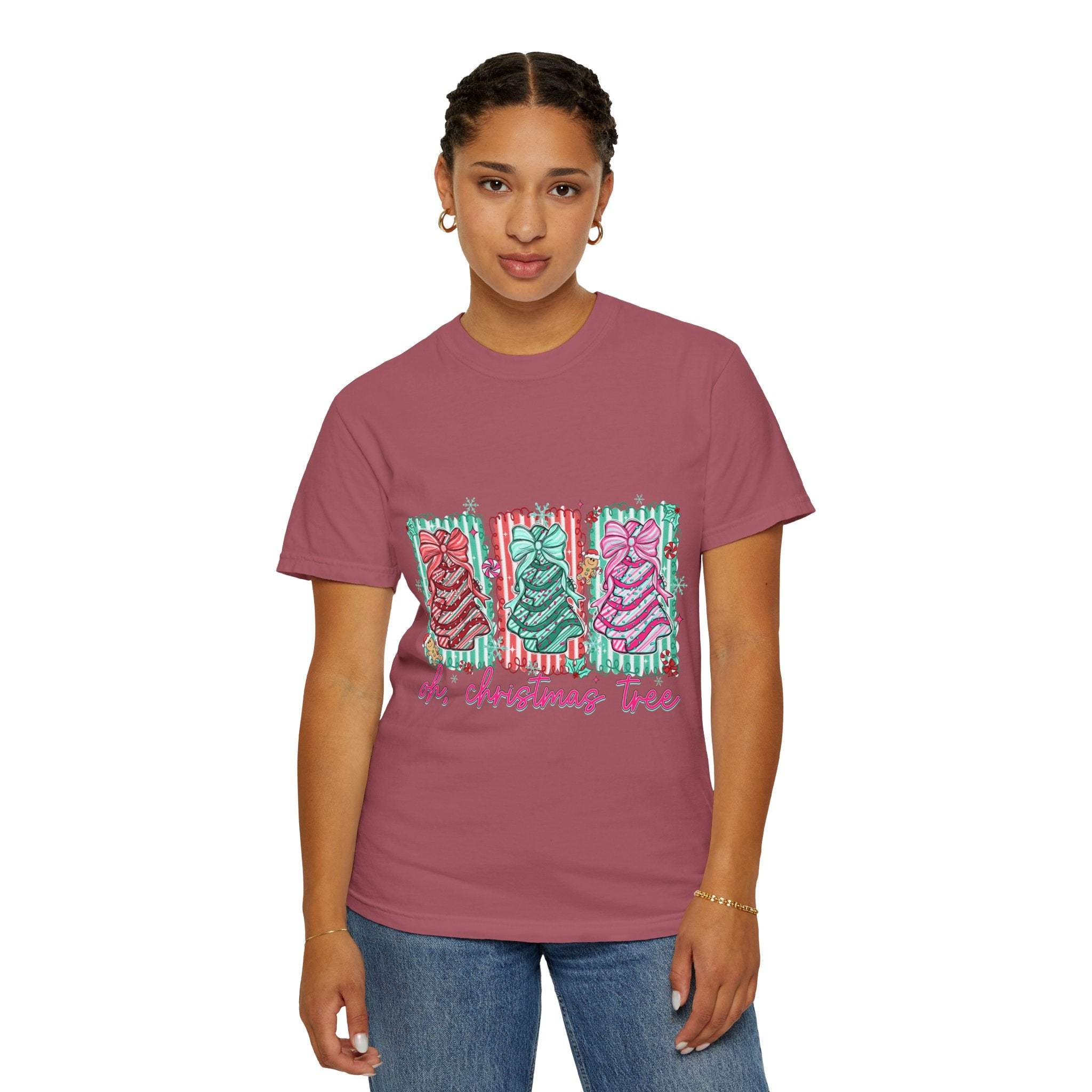 Woman wearing a preppy Oh Christmas Tree T-shirt with festive holiday graphics in garment-dyed fabric