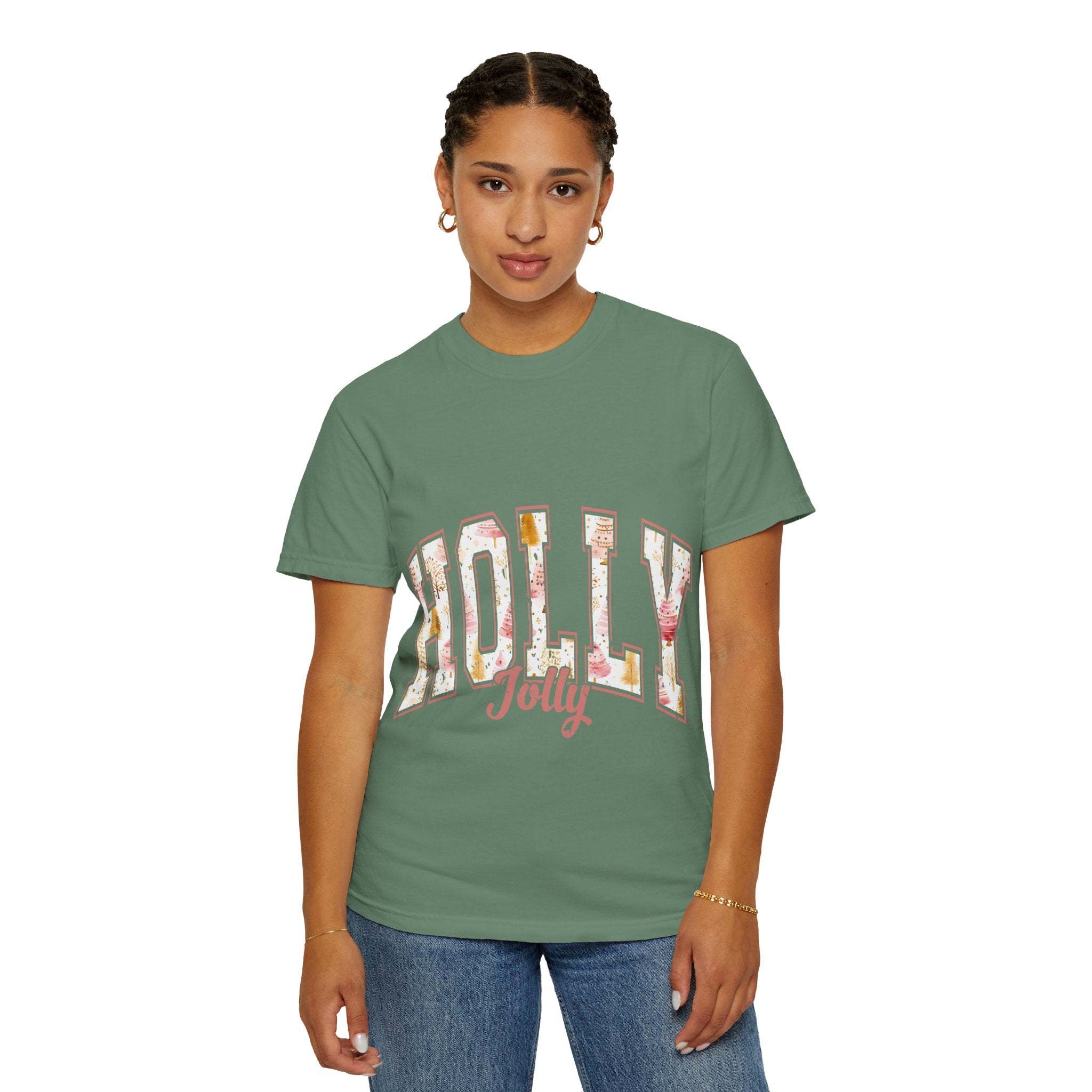 Woman wearing a green Varsity Holly Jolly T-shirt with festive lettering, unisex garment-dyed cotton tee, relaxed fit
