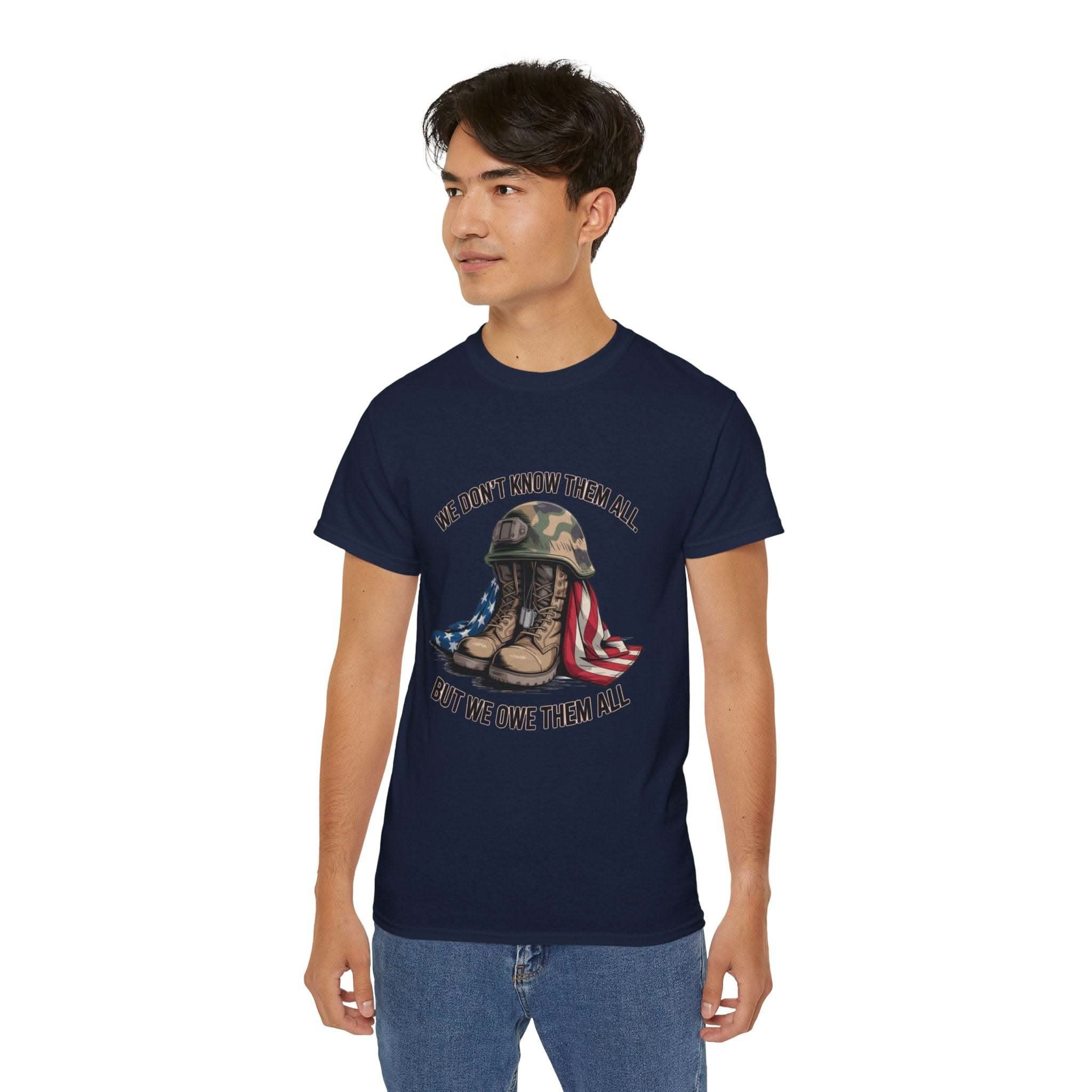 Unisex navy vintage-style T-shirt with veteran tribute graphic and "We Don’t Know Them All But We Owe Them All" text