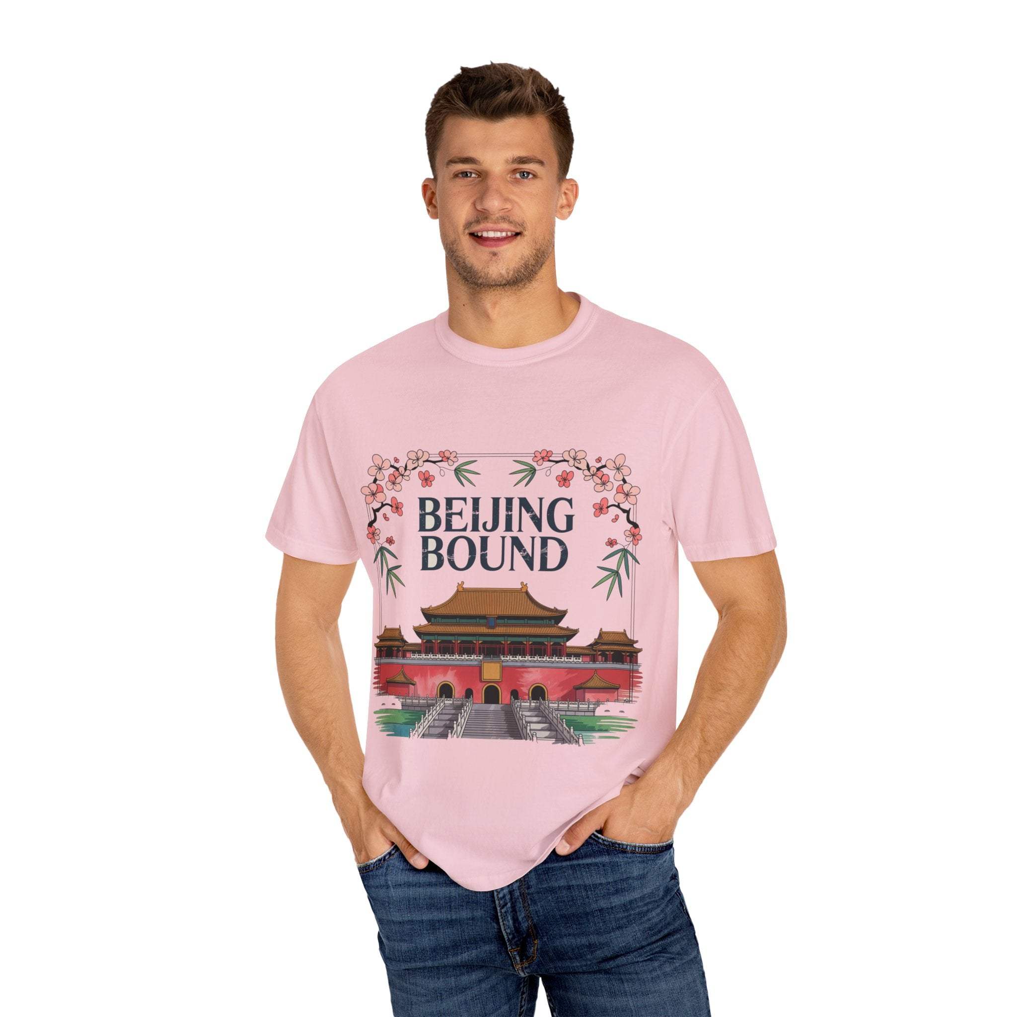 Pink travel t-shirt with Beijing Bound design featuring traditional Chinese architecture and floral accents worn by smiling man