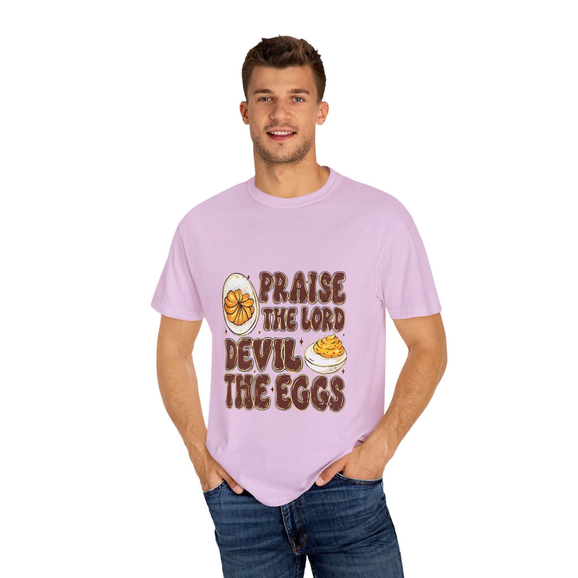 White cotton t-shirt featuring 'Praise the Lord, Devil the Eggs' design, perfect for Easter and Christian apparel.
