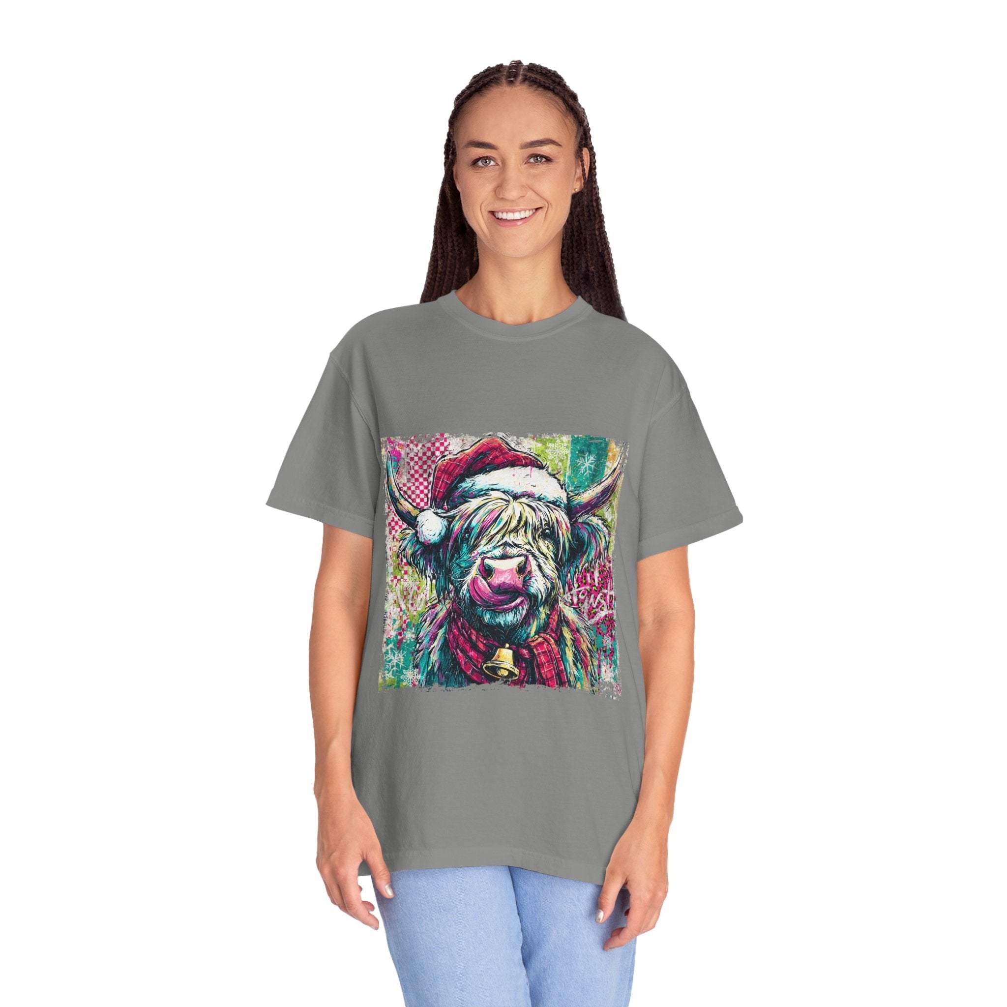 Woman wearing gray Retro Santa Highland Cow T-shirt with colorful festive cow design
