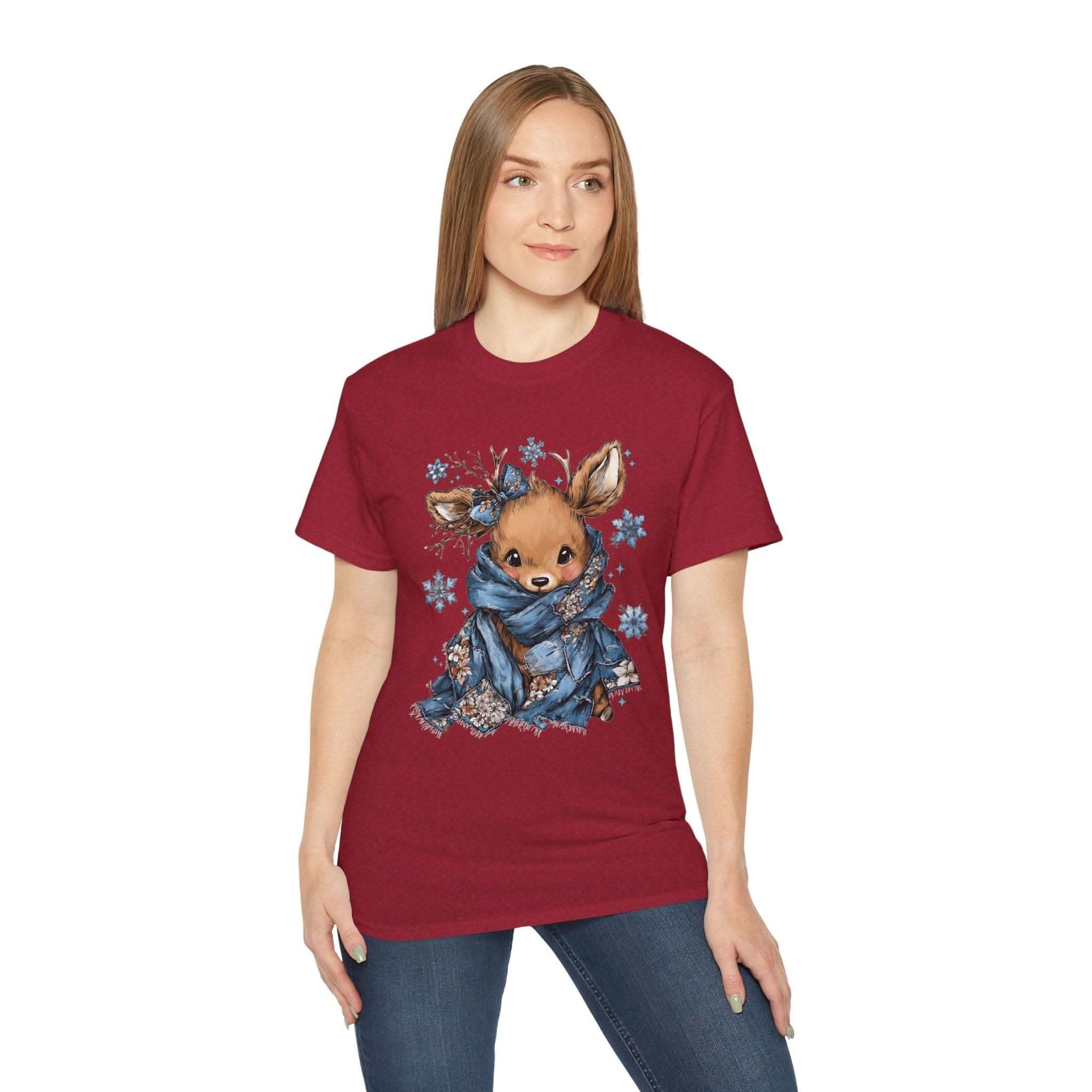 White t-shirt with retro patchwork reindeer design wearing blue scarf and surrounded by snowflakes