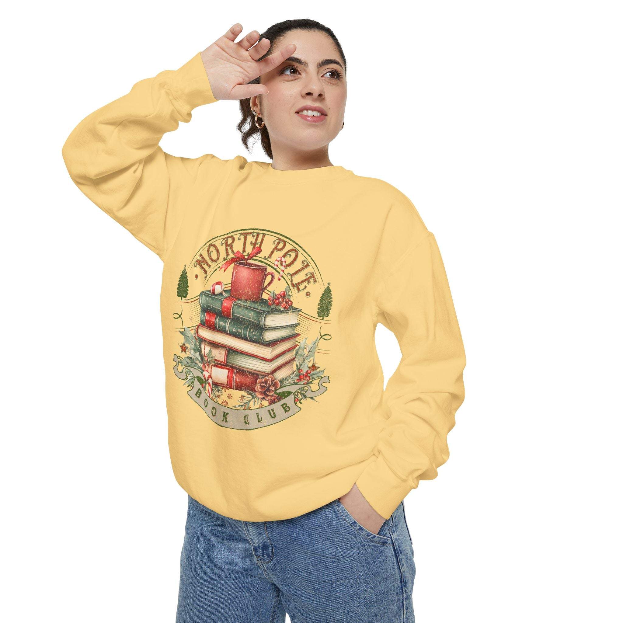Vintage North Pole Book Club sweatshirt in yellow with holiday book stack design, cozy cotton-poly blend, ribbed cuffs and collar