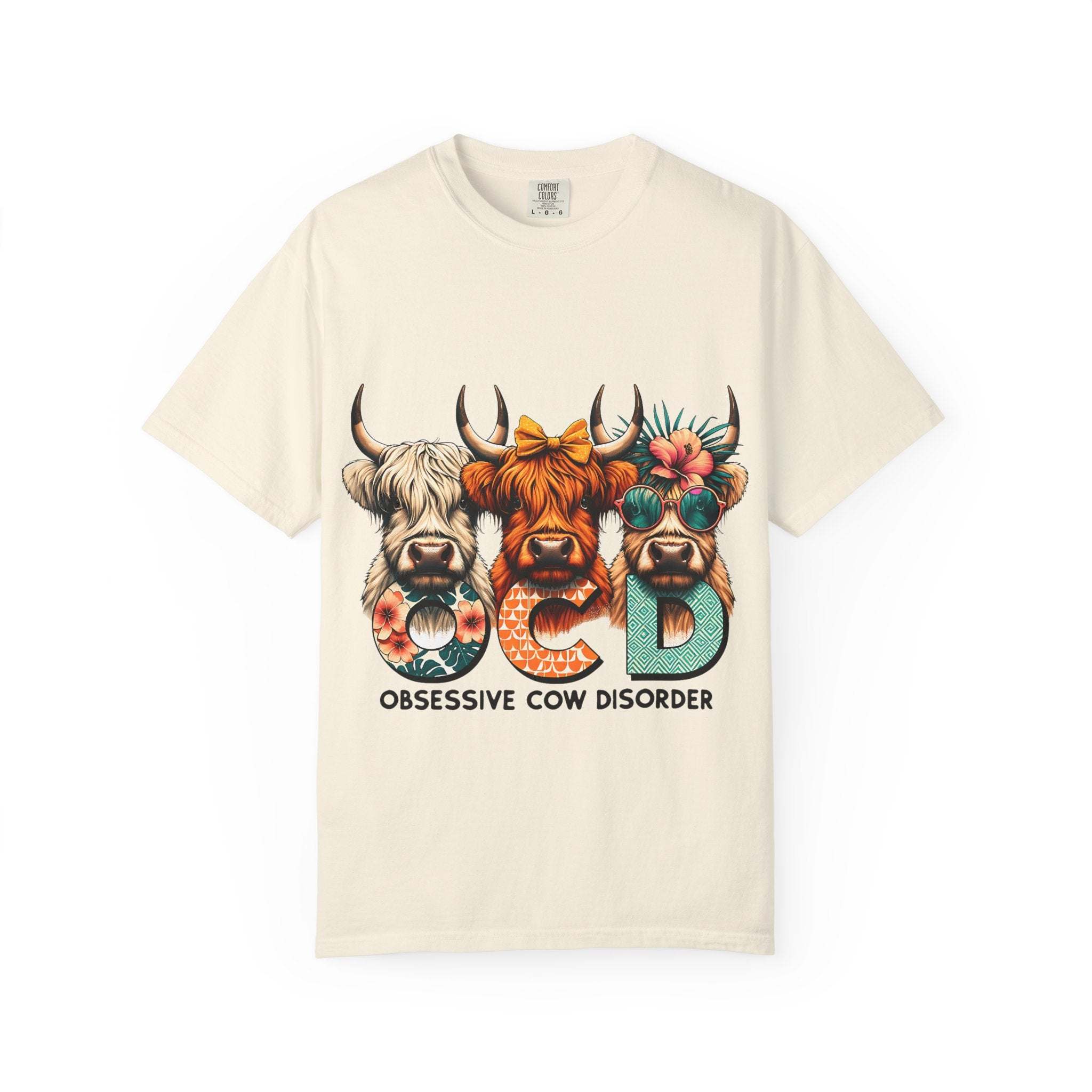Ivory funny T-shirt featuring 'OCD Obsessive Cow Disorder' text, perfect for animal lovers and casual wear.
