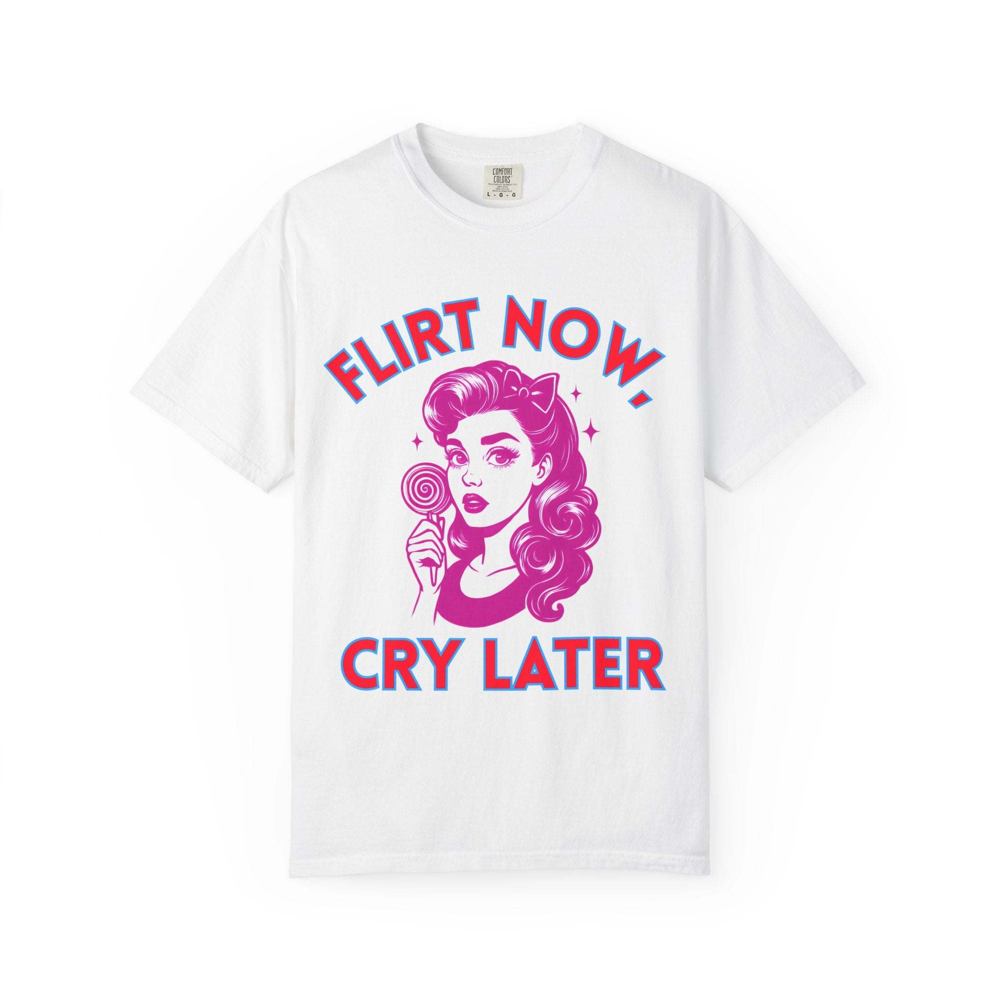 White garment-dyed T-shirt with pink and blue "Flirt Now, Cry Later" graphic and retro woman illustration