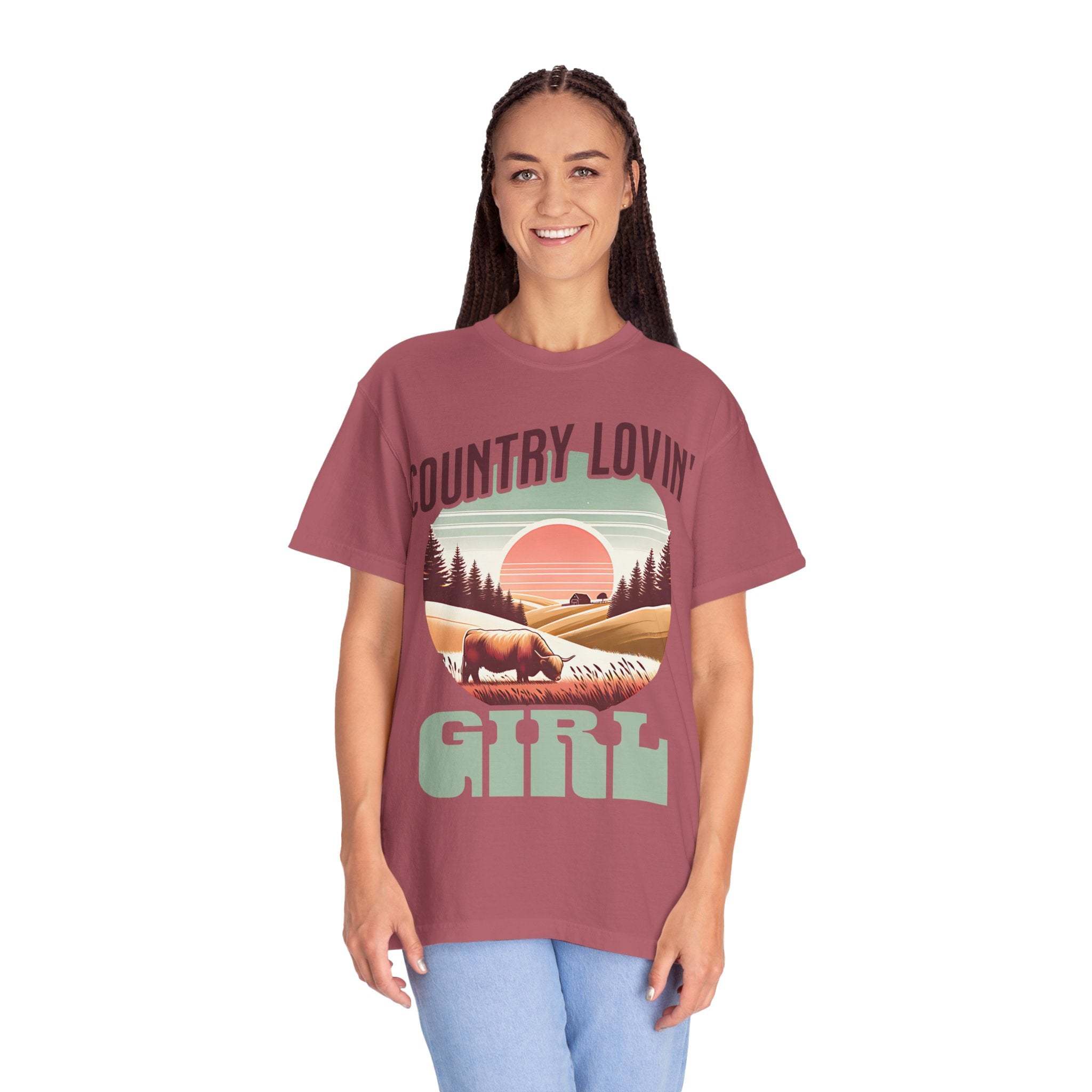 Woman wearing vintage style Country Lovin Girl T-shirt with sunset and cattle graphic