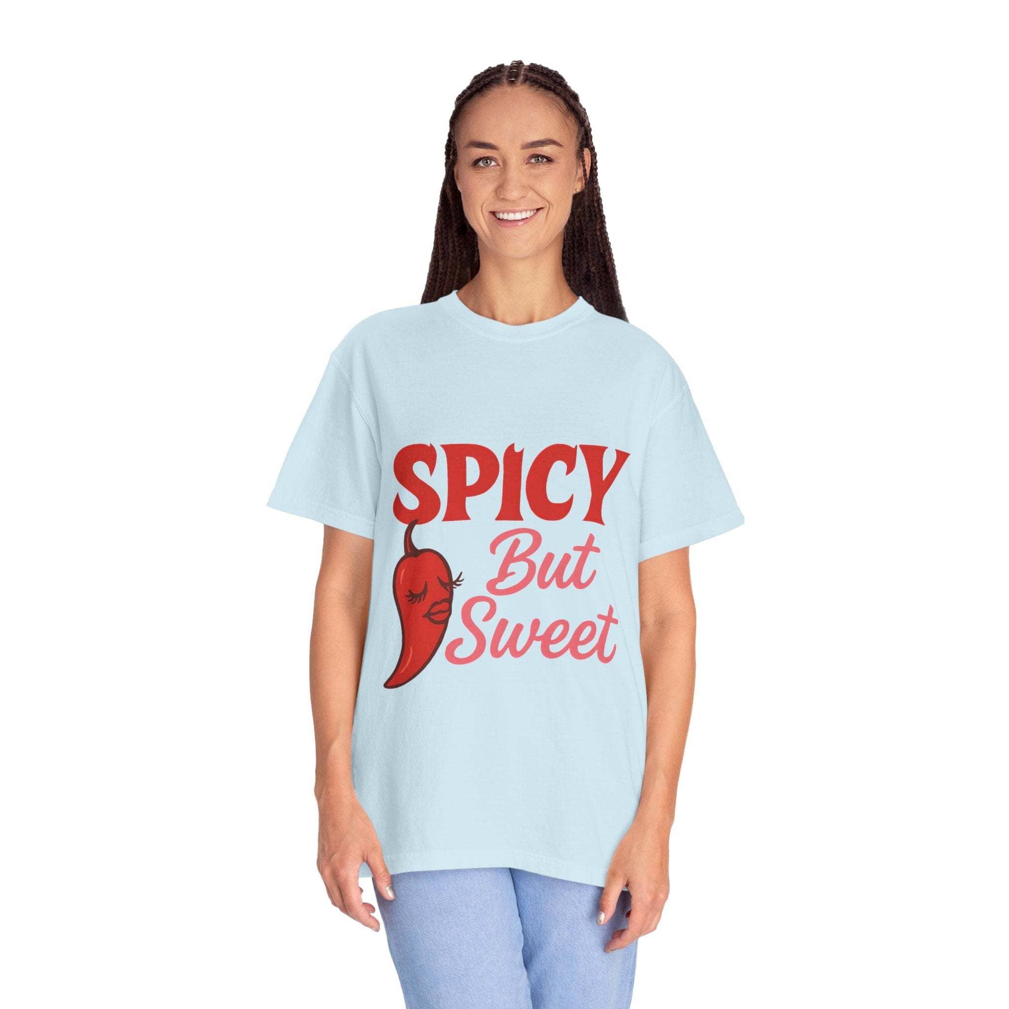 Smiling woman wearing light blue Spicy But Sweet T-shirt with red chili graphic and text, casual unisex garment-dyed tee for foodies