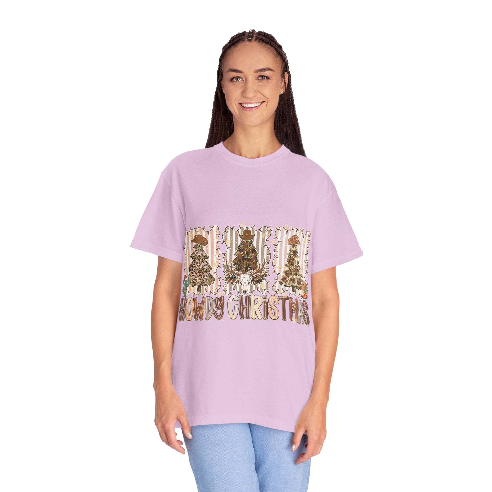 Woman wearing a lavender Cowboy Howdy Christmas t-shirt with festive tree designs and text, styled for holiday cowboy flair