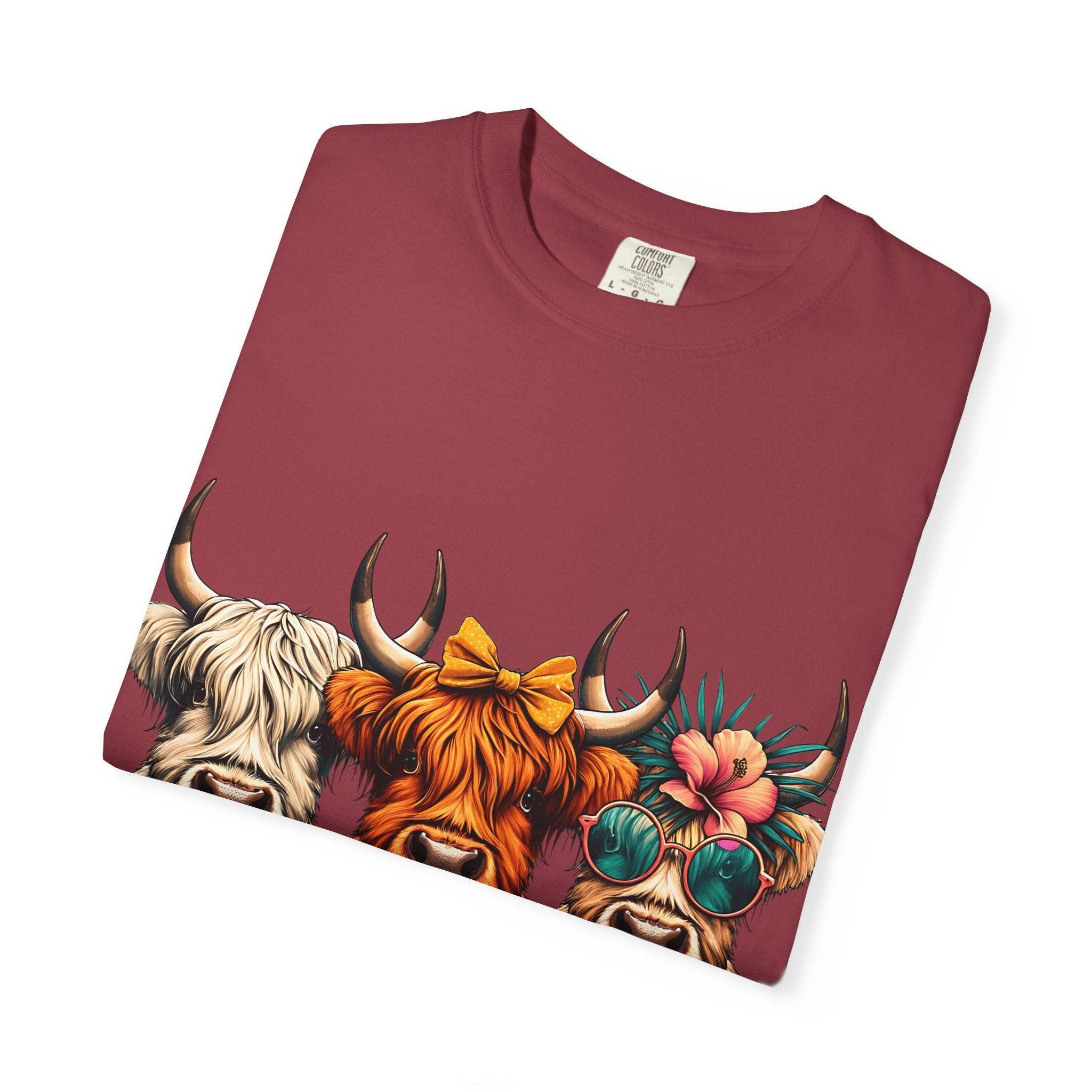 Funny OCD Obsessive Cow Disorder graphic T-shirt with colorful cow faces on maroon garment-dyed fabric