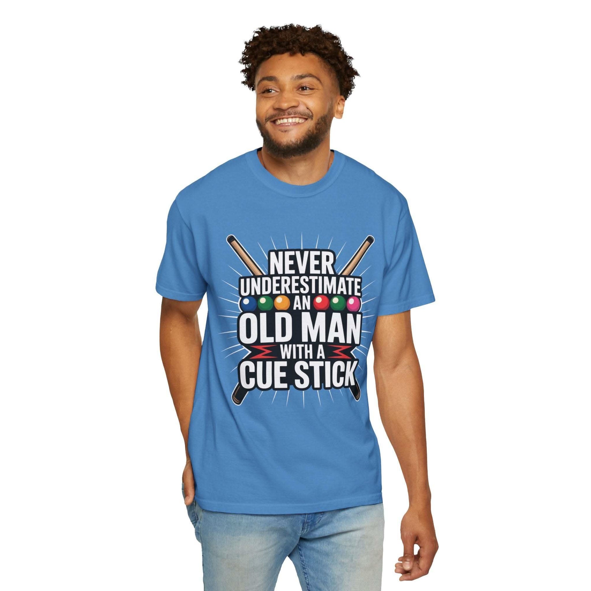 Man wearing a blue t-shirt with a humorous design and text.