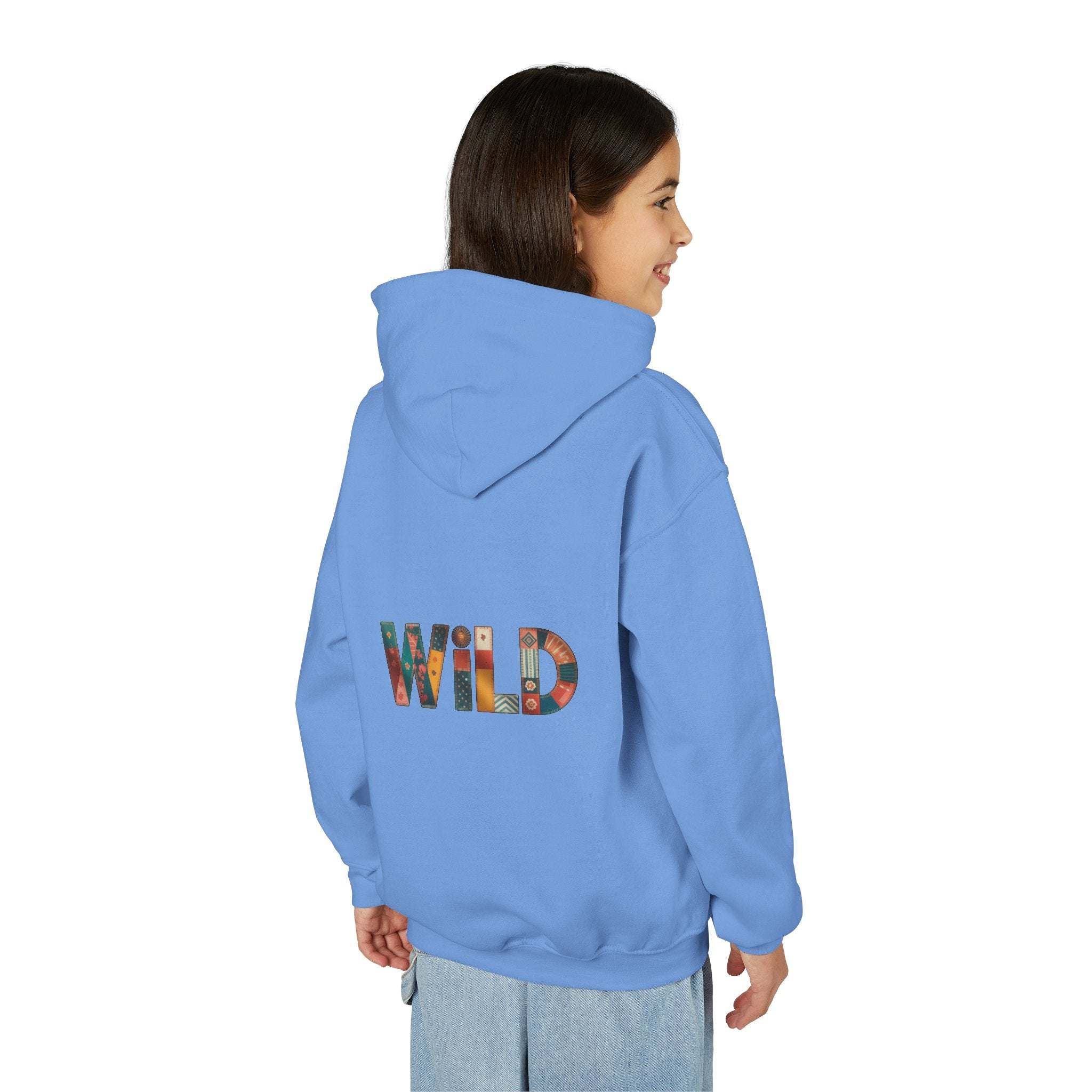 Child wearing blue Patchwork Wild Word Hoodie with colorful "WILD" text on back
