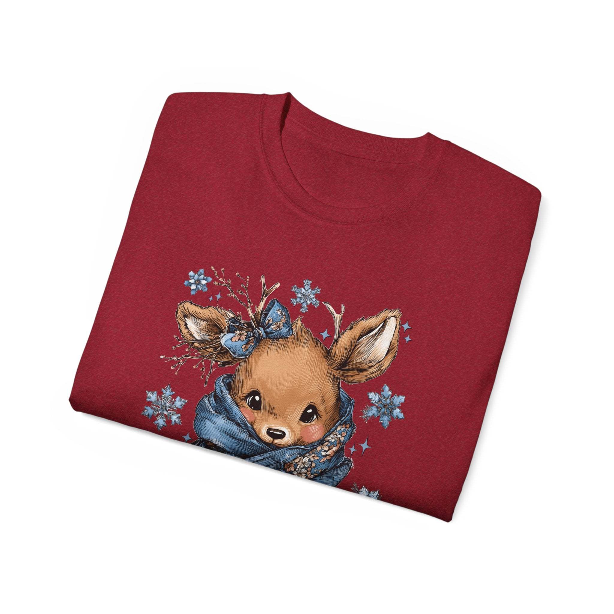 White t-shirt with retro patchwork reindeer design wearing blue scarf and surrounded by snowflakes