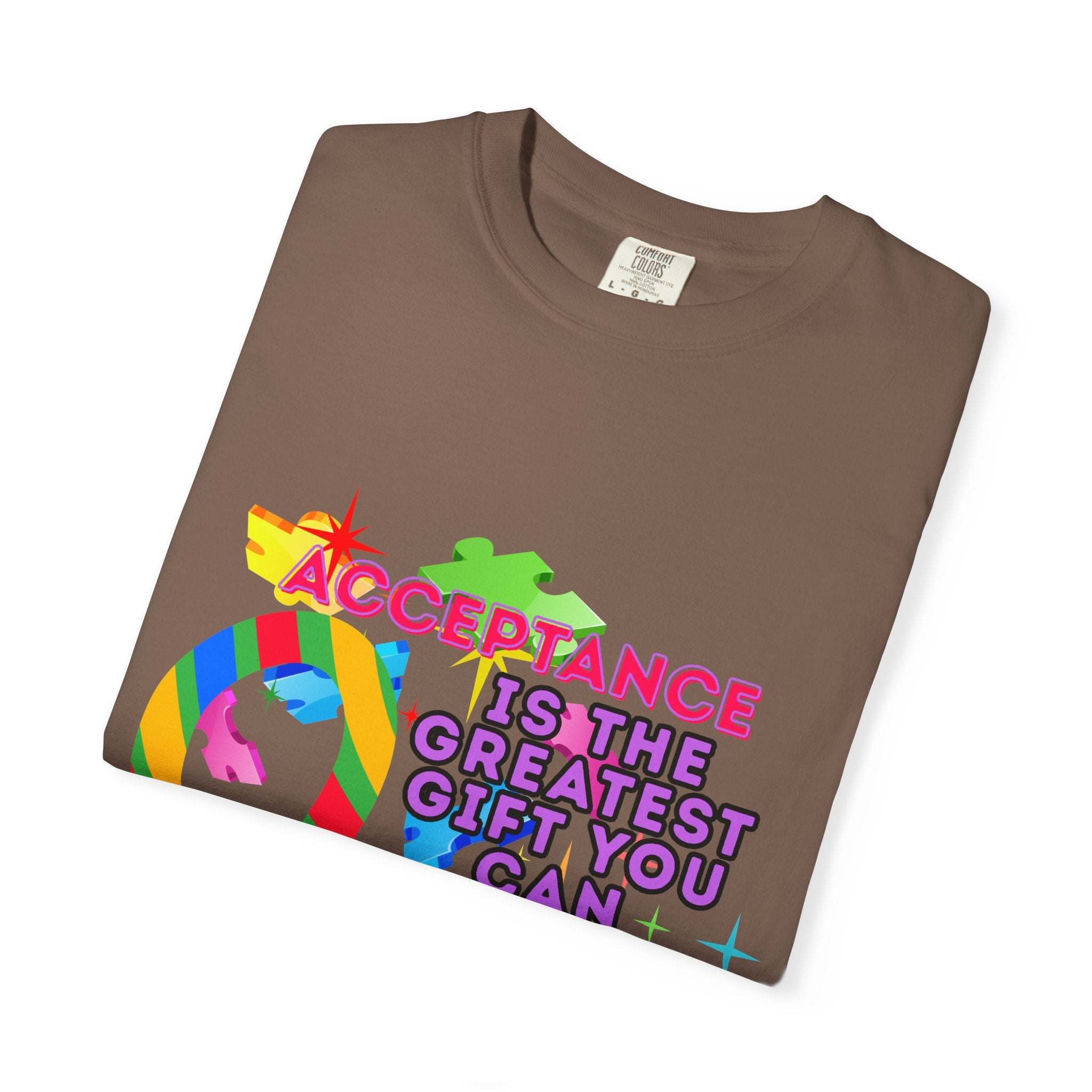 Garment-dyed brown Autism Acceptance T-shirt with colorful puzzle and text design promoting inclusivity and awareness