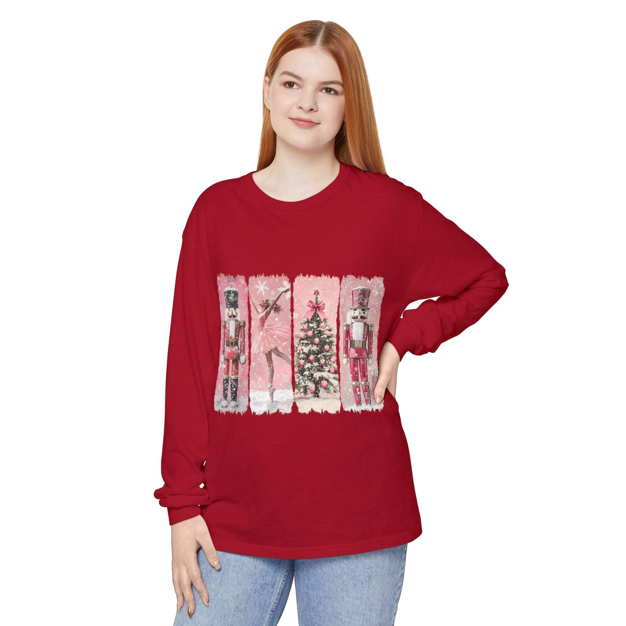 Red long sleeve t-shirt with watercolor nutcracker and Christmas tree design on front worn by woman