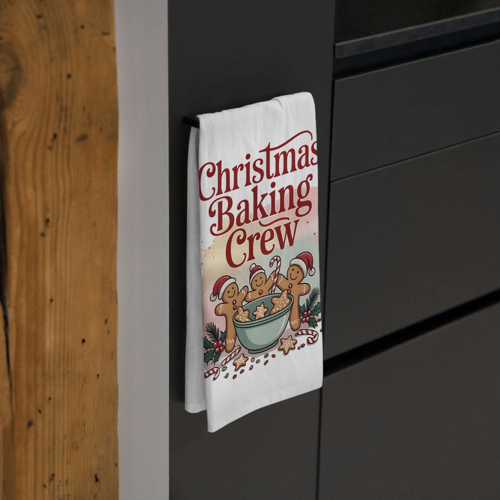 White cotton tea towel with 'Christmas Baking Crew' design, ideal for festive kitchen decor.