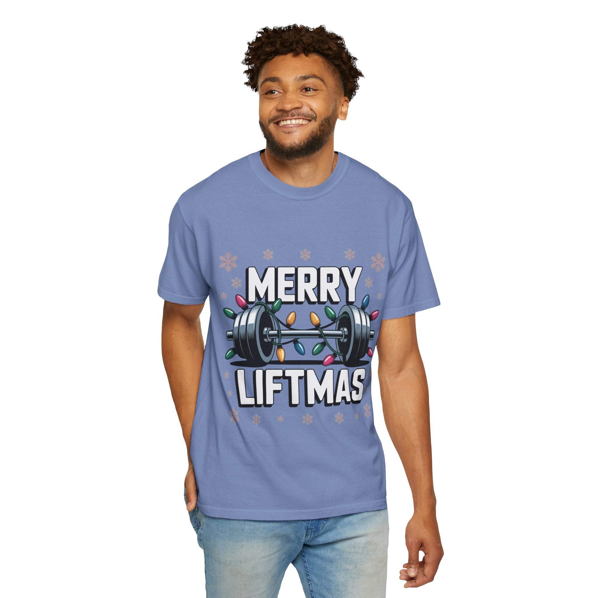 Man wearing blue Merry Liftmas Christmas Workout T-shirt with barbell and holiday lights design