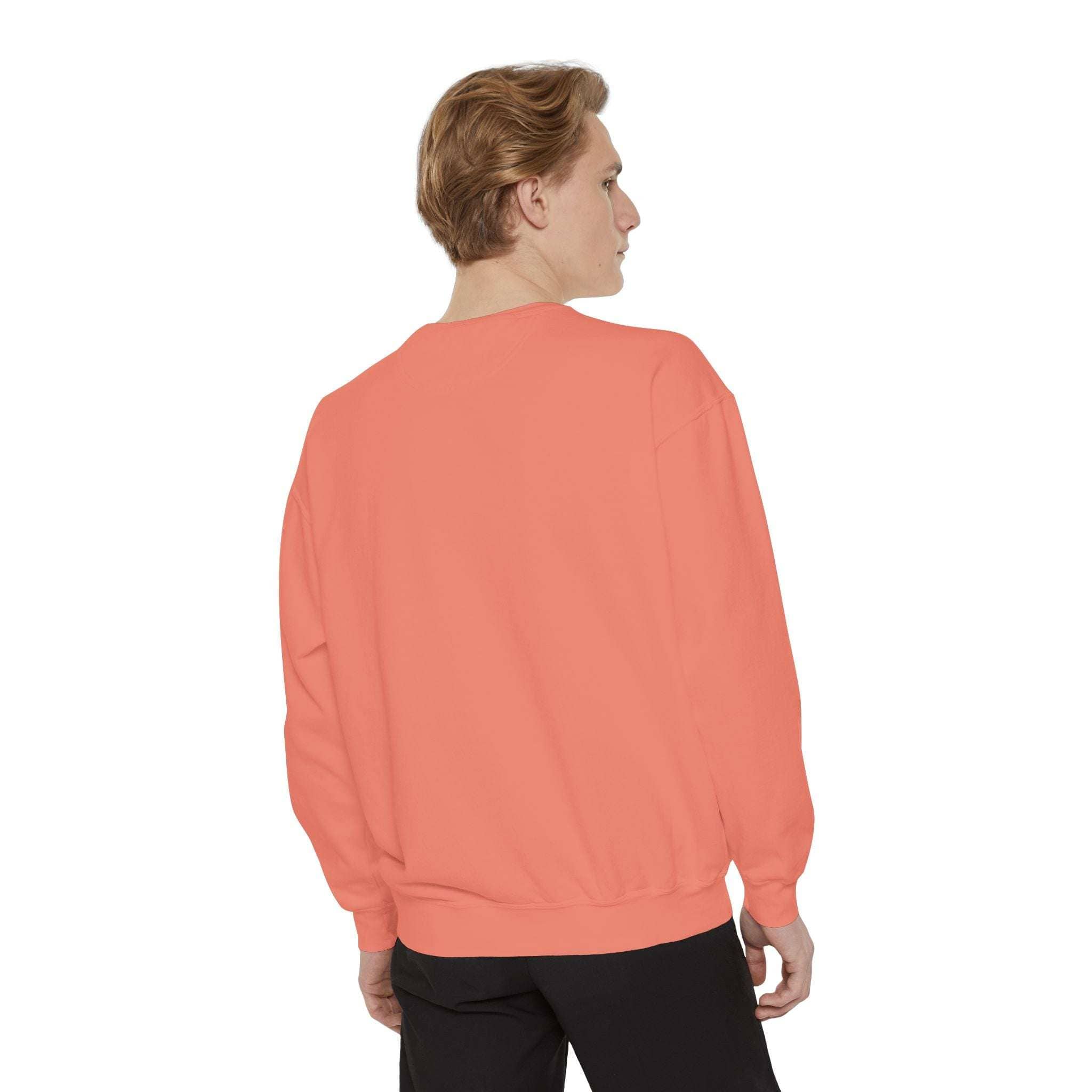 Man wearing peach Vintage North Pole Book Club sweatshirt with ribbed collar and cuffs, shown from back