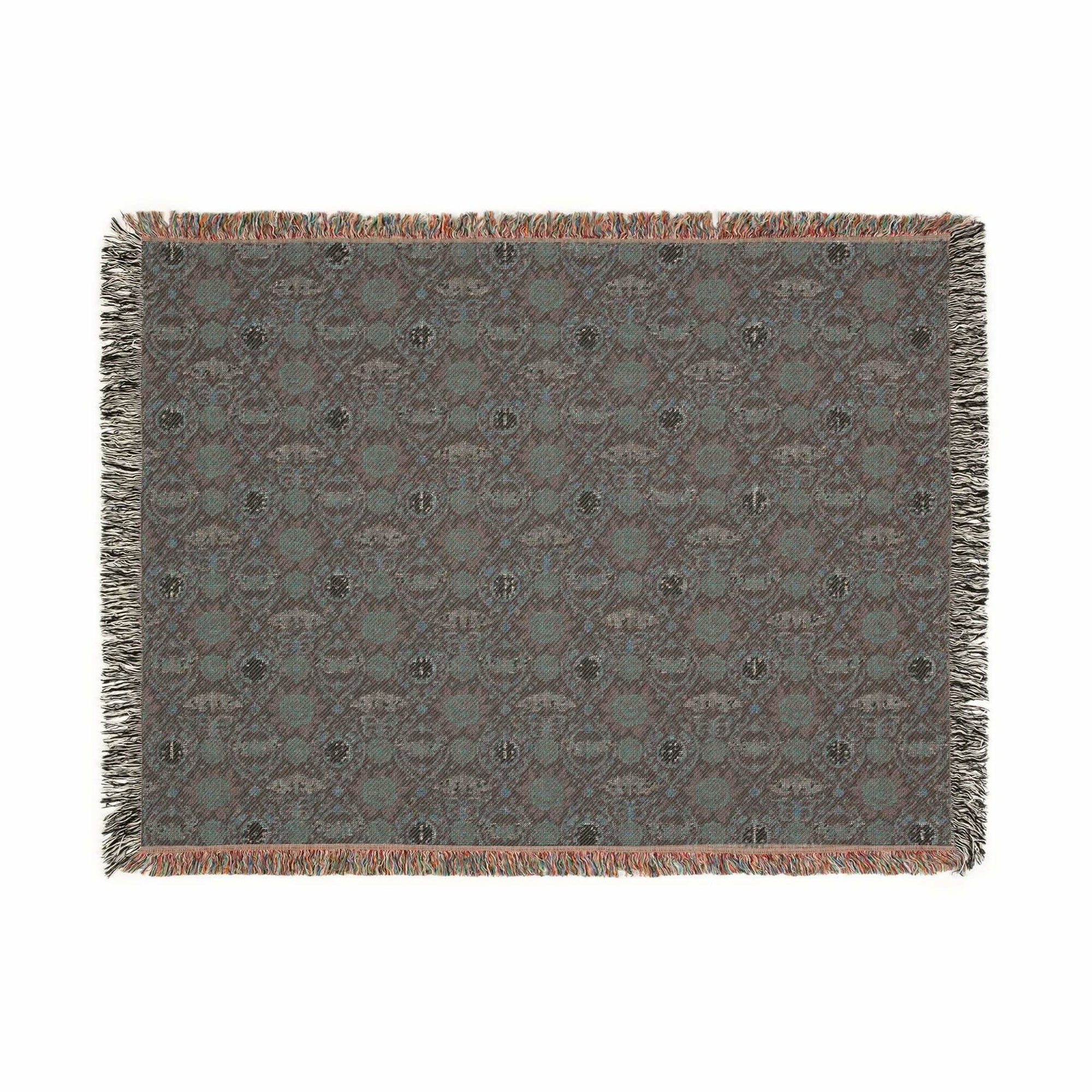 Victorian Gothmas Woven Blanket with candlelight-inspired dark and crimson hues and colorful fringed edges