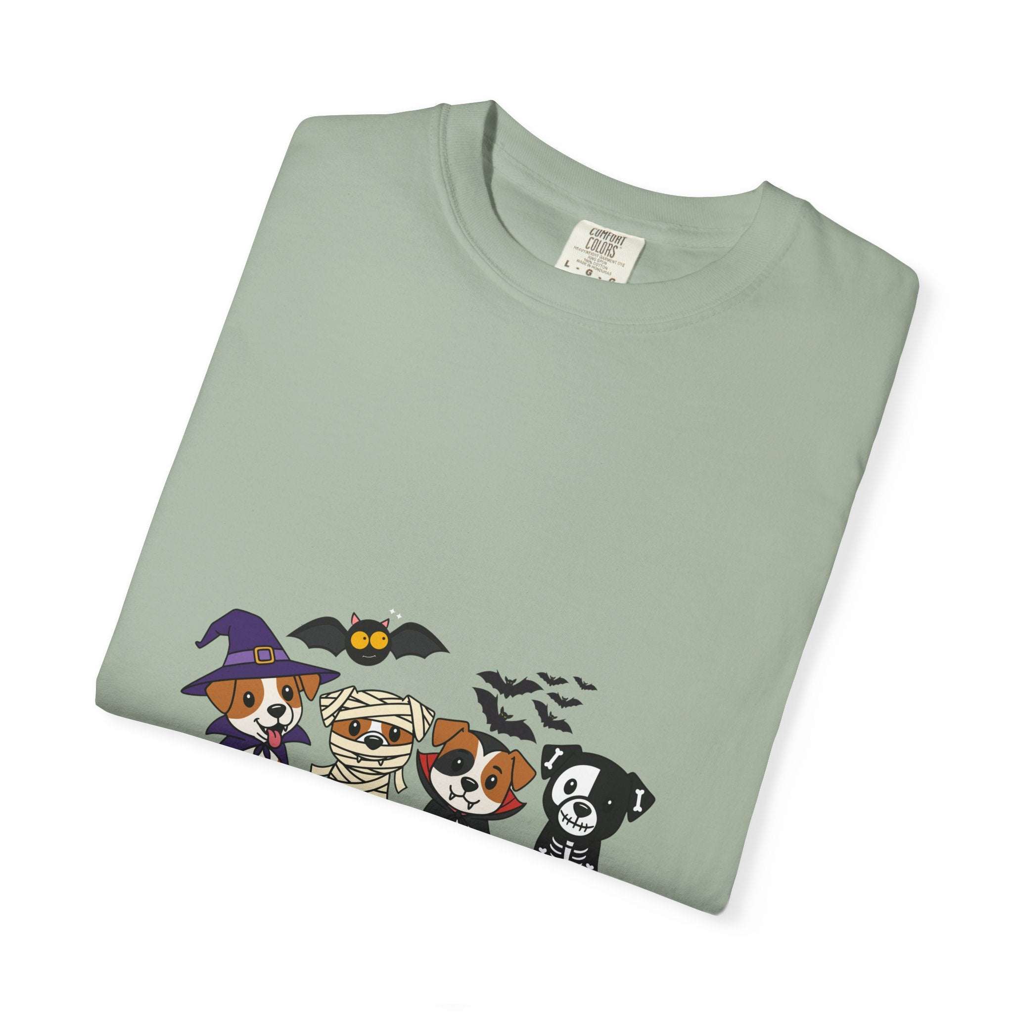 Folded light green Puppies Halloween T-shirt with cartoon dogs in Halloween costumes printed on front
