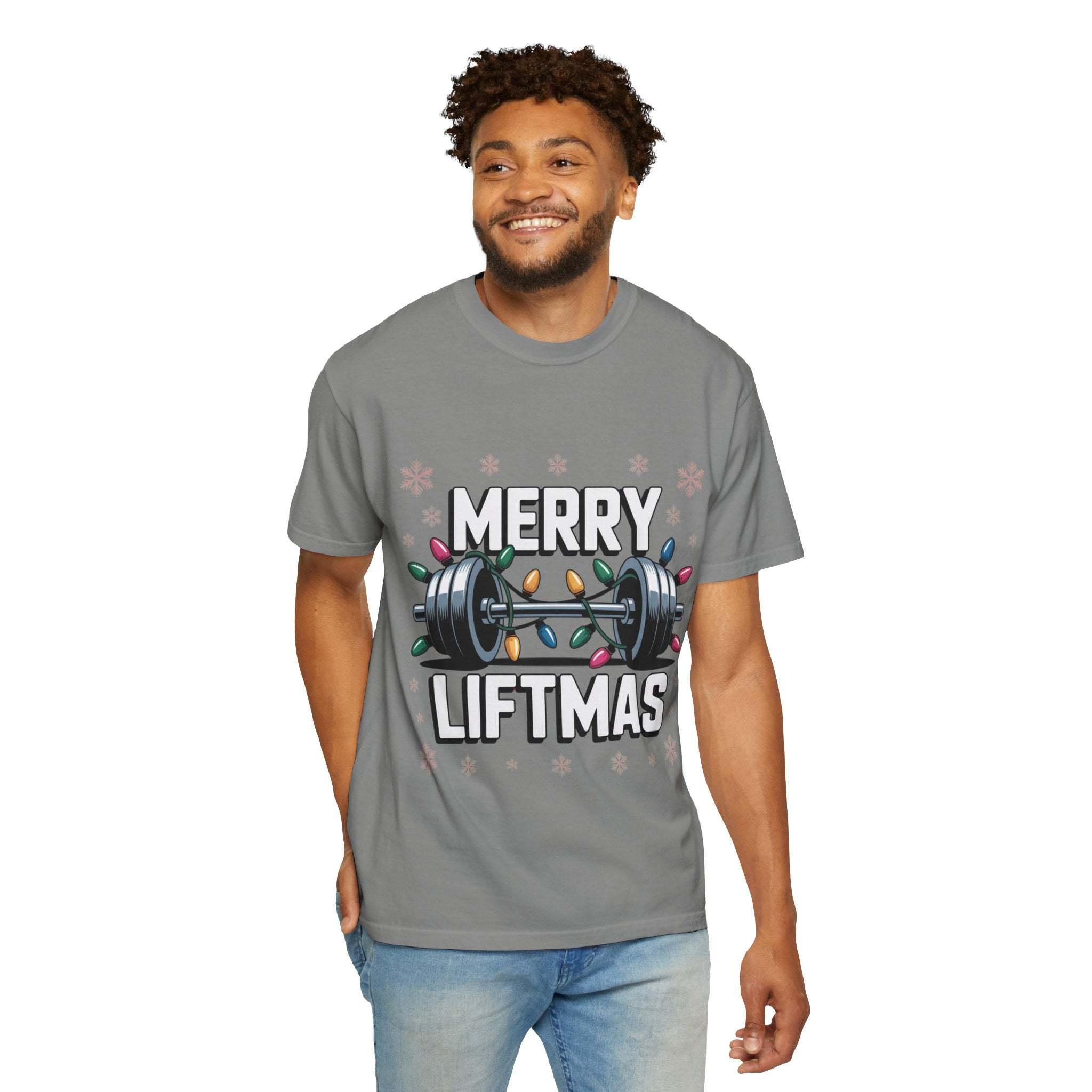 Man wearing grey Merry Liftmas Christmas Workout T-shirt with barbell and holiday lights design