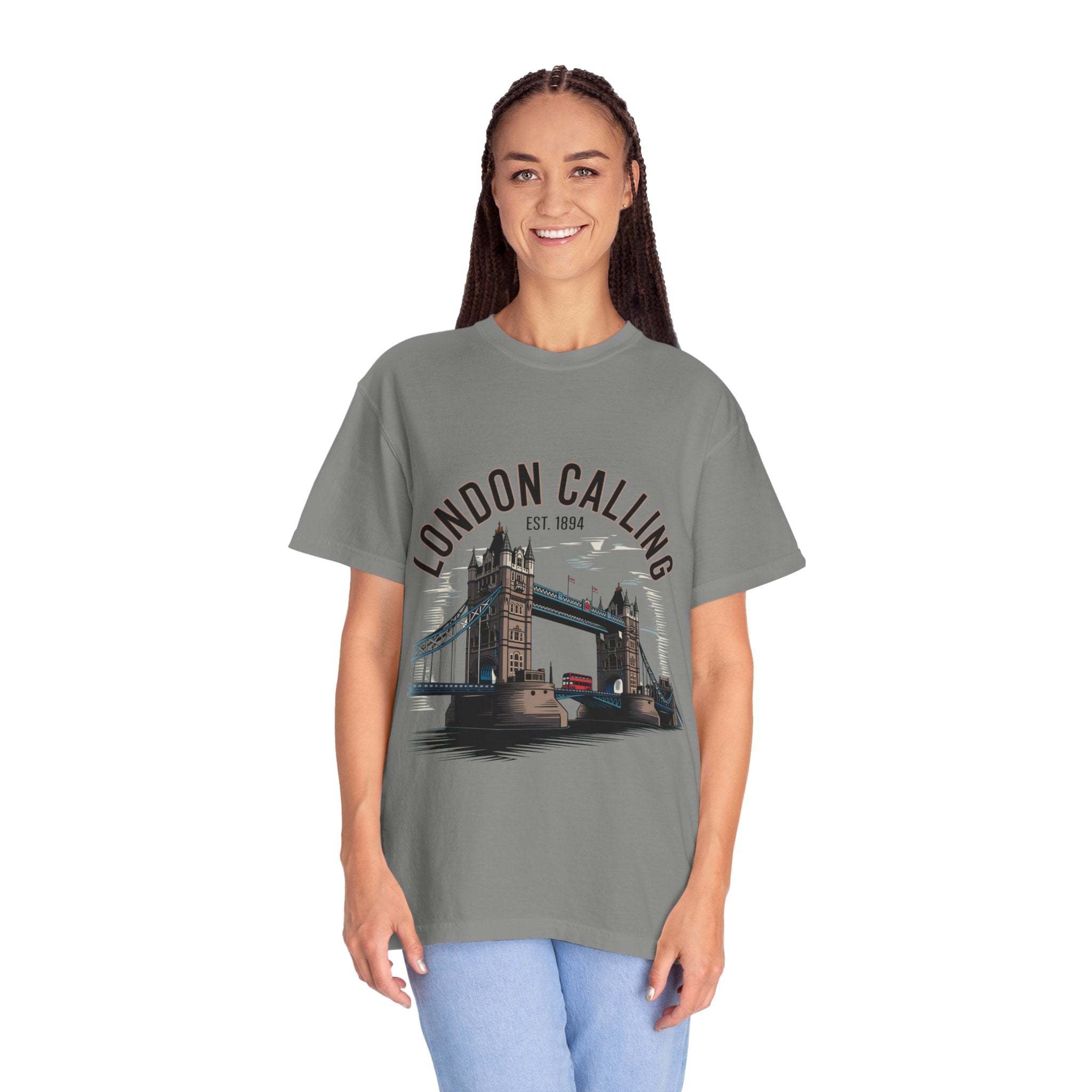 Woman wearing London Calling Travel T-shirt with Tower Bridge graphic design, unisex garment-dyed cotton tee