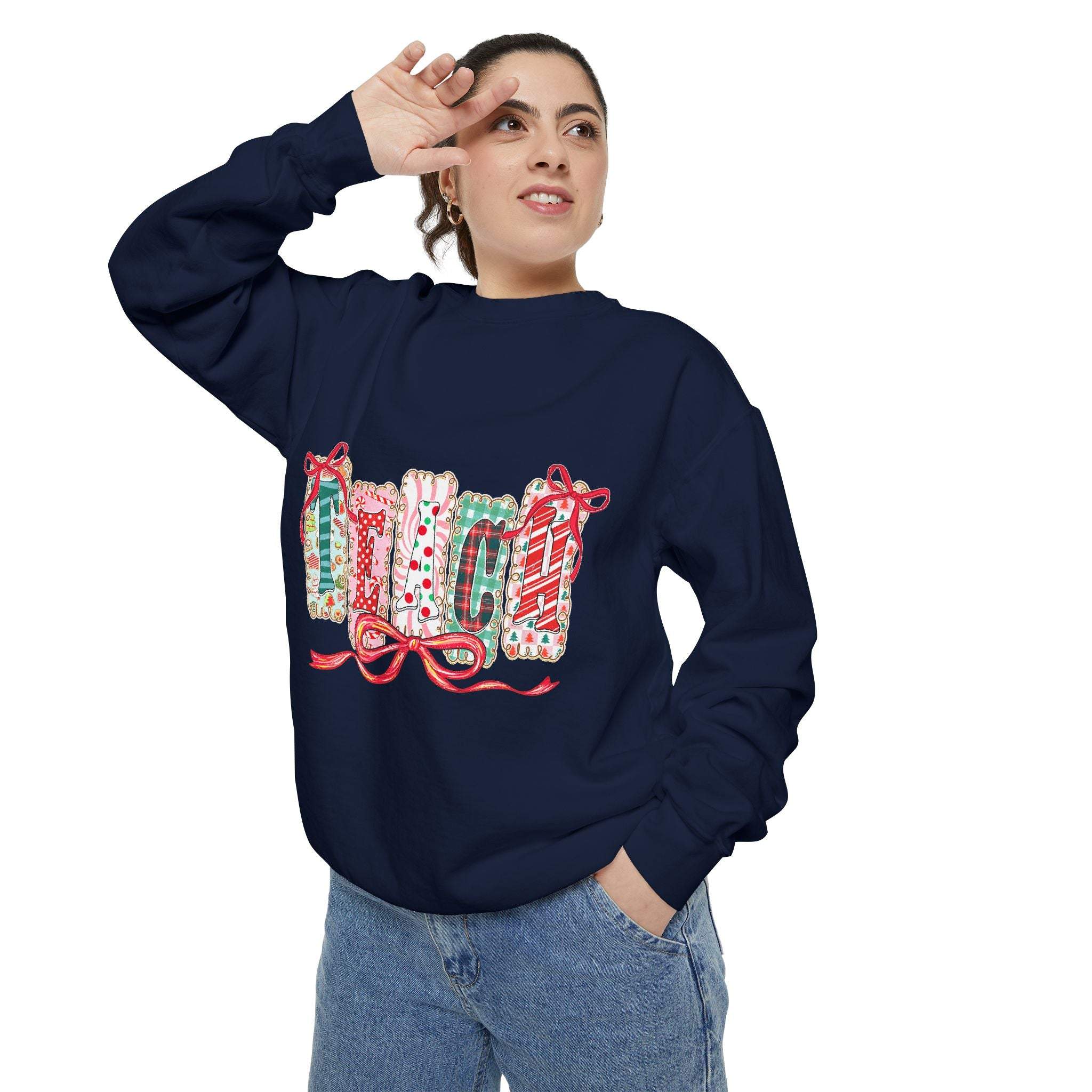 woman wearing navy blue sweatshirt preppy teach christmas with festive holiday design