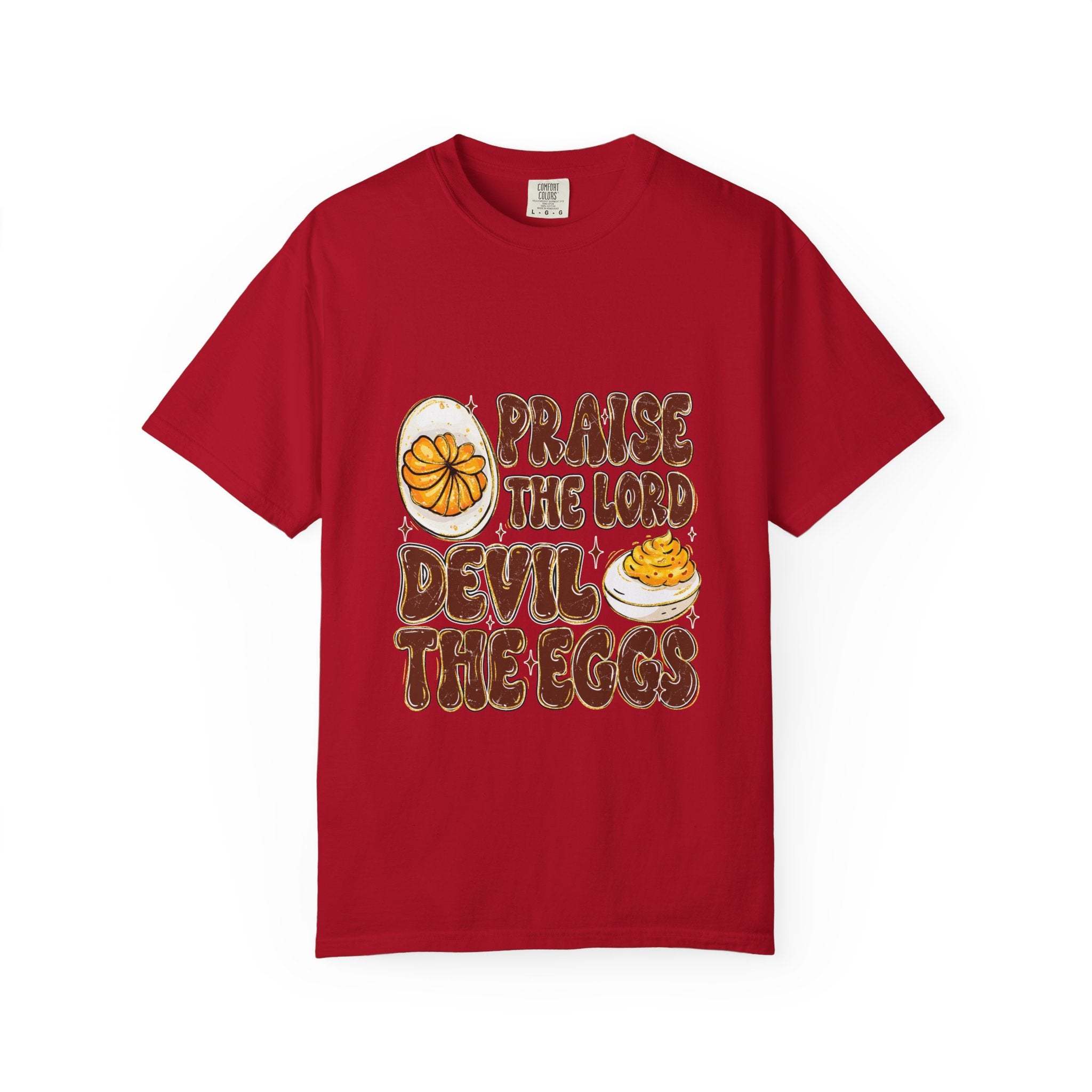 White cotton t-shirt featuring 'Praise the Lord, Devil the Eggs' design, perfect for Easter and Christian apparel.