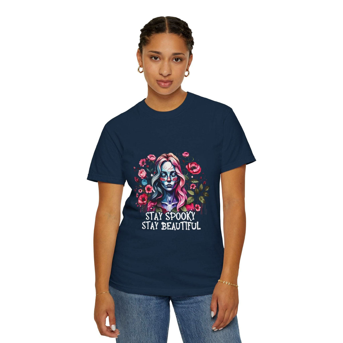 Woman wearing navy floral skeleton t-shirt with "Stay Spooky Stay Beautiful" design, relaxed fit.