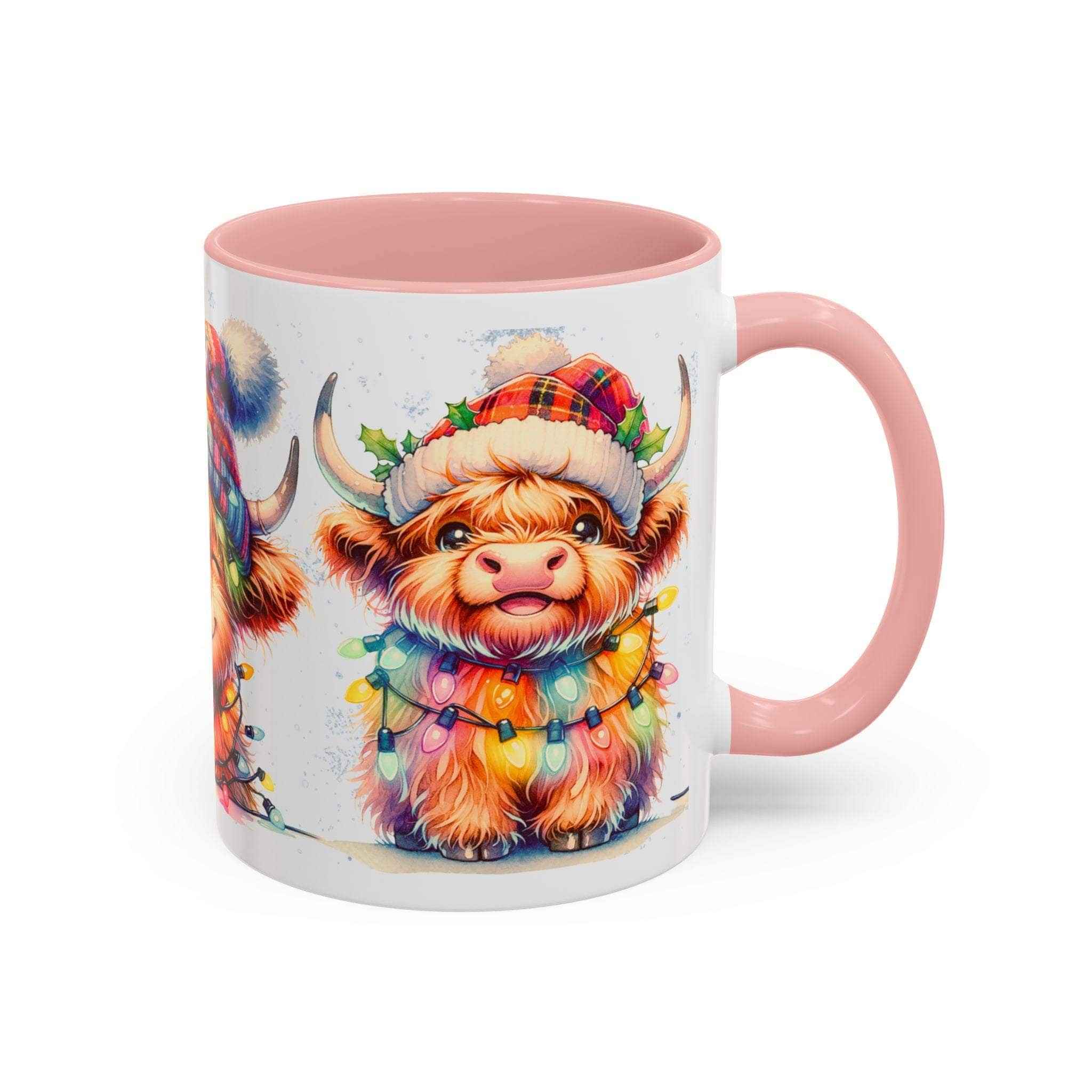 Mug with a colorful highland cow design and pink interior and handle on a white background