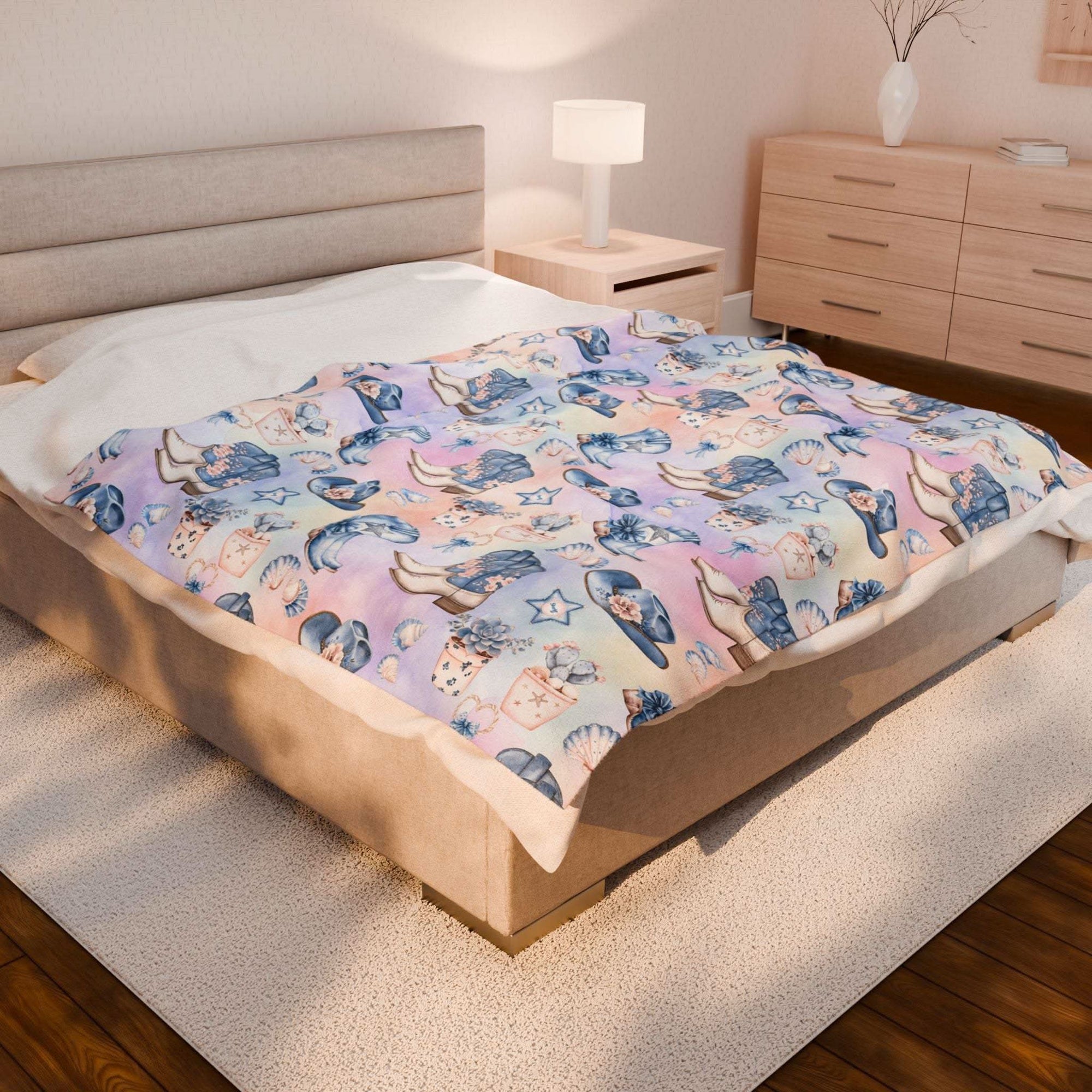Coastal Cowgirl design plush blanket on bed in modern bedroom setting